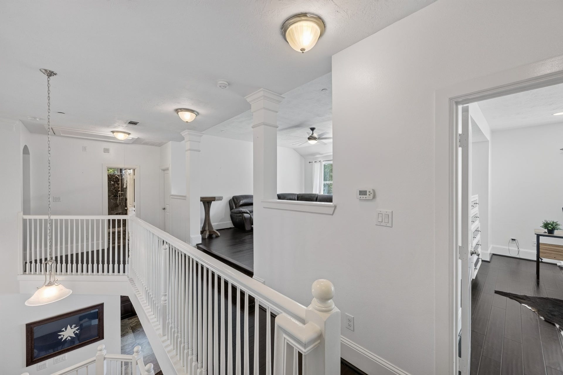 Bright upstairs landing overlooking downstairs.
