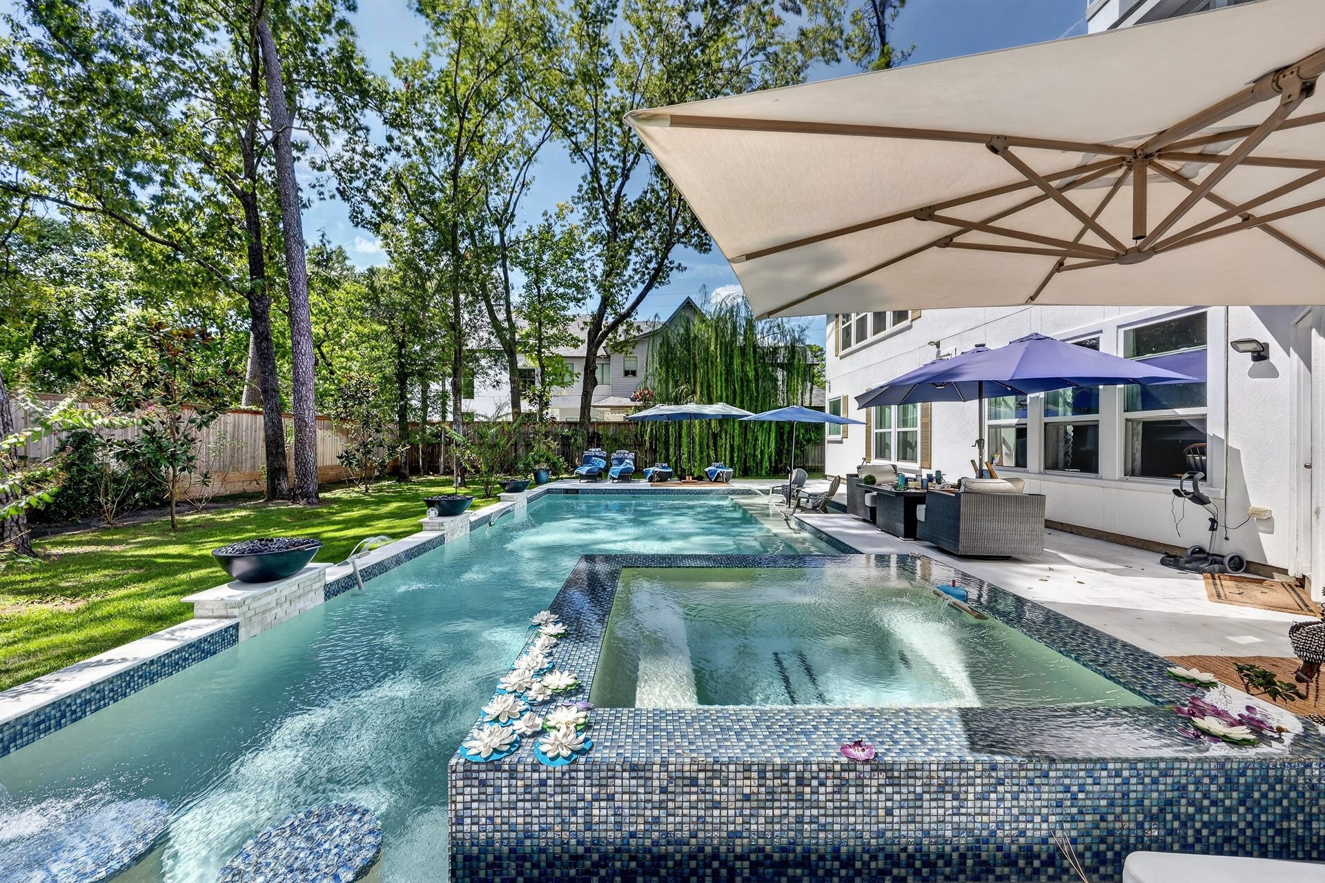 Resort-style pool with spa and tranquil views.