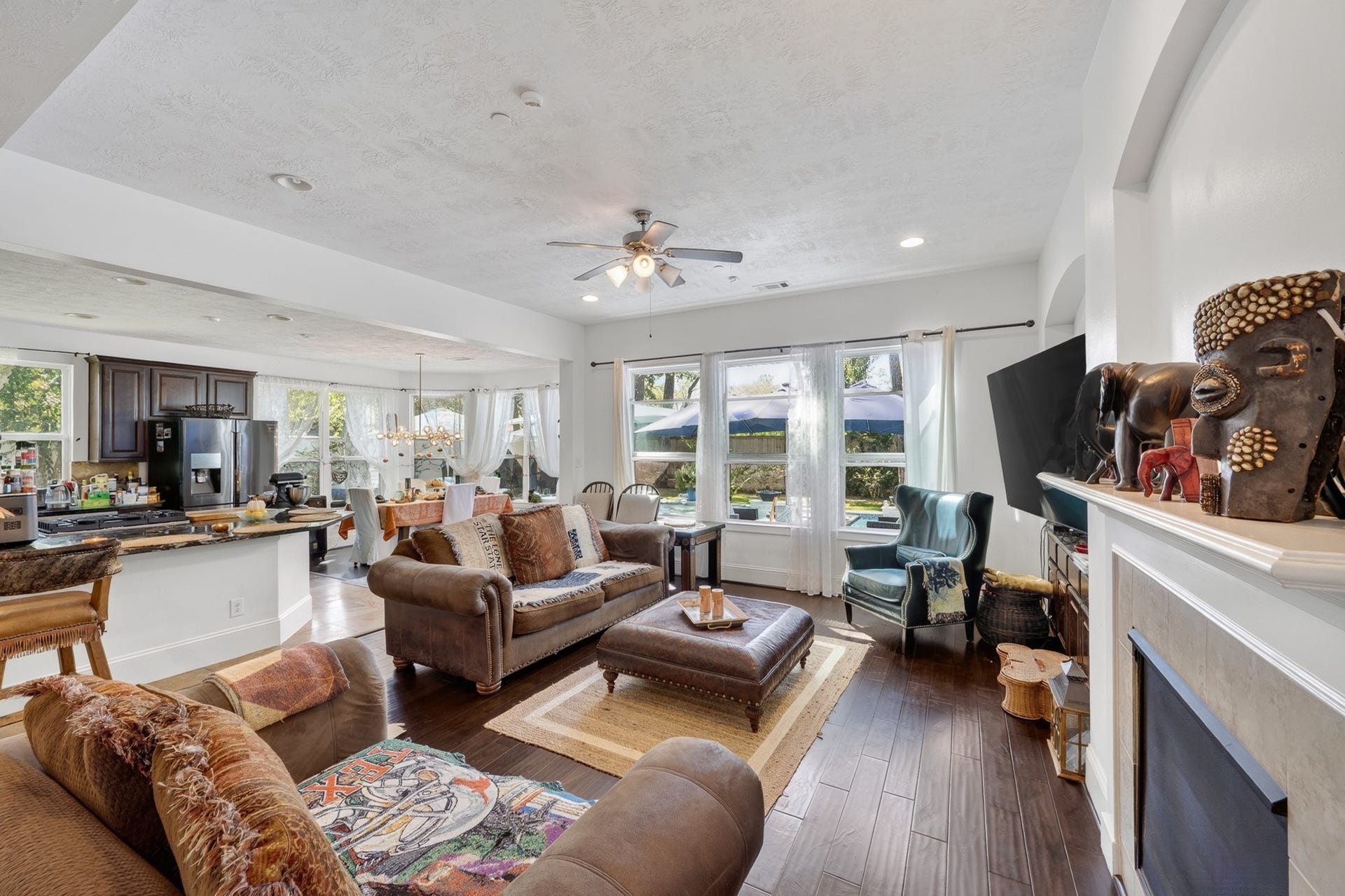 Expansive gathering room filled with natural light and timeless finishes.