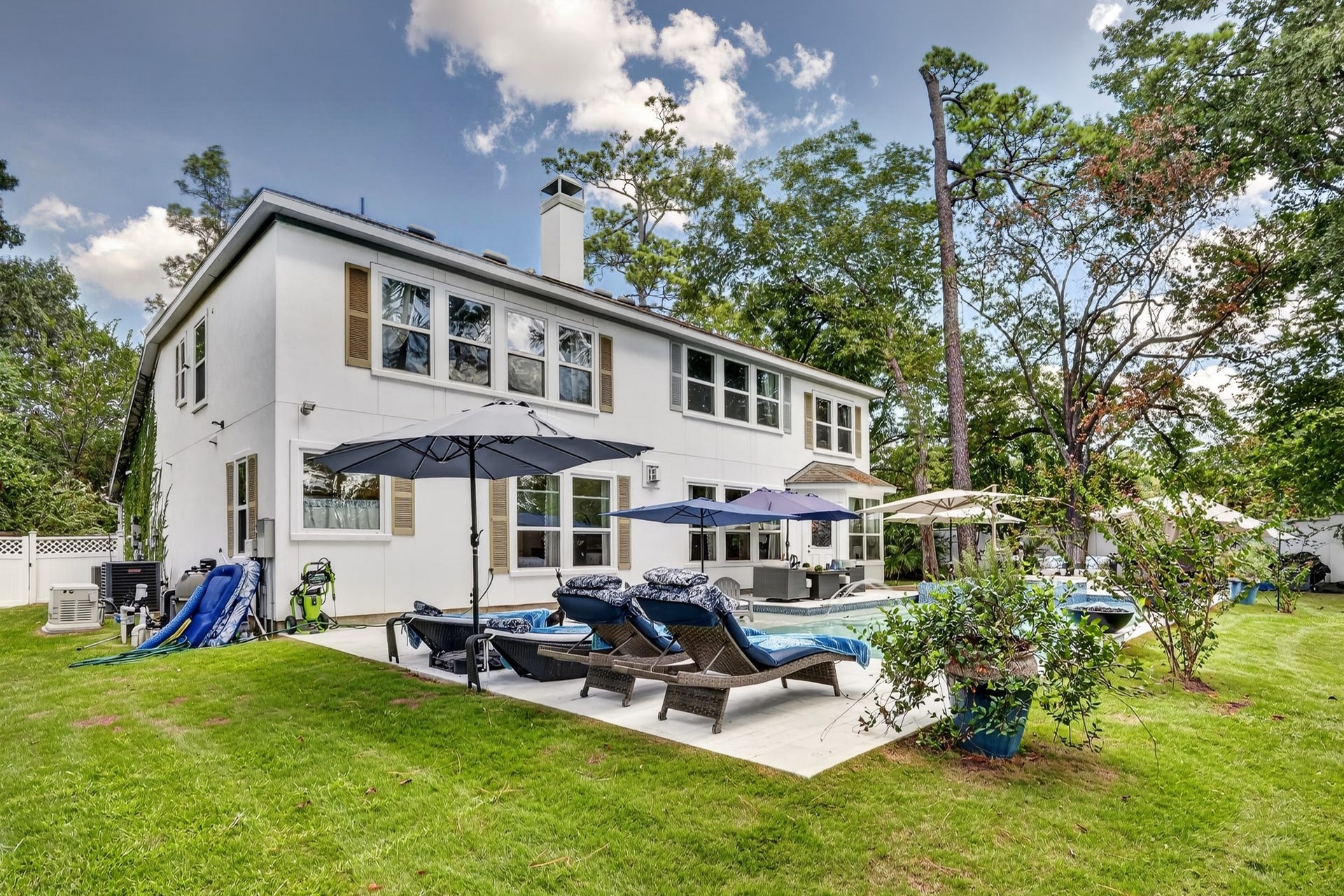 Spacious backyard retreat with lush lawn and mature landscaping.