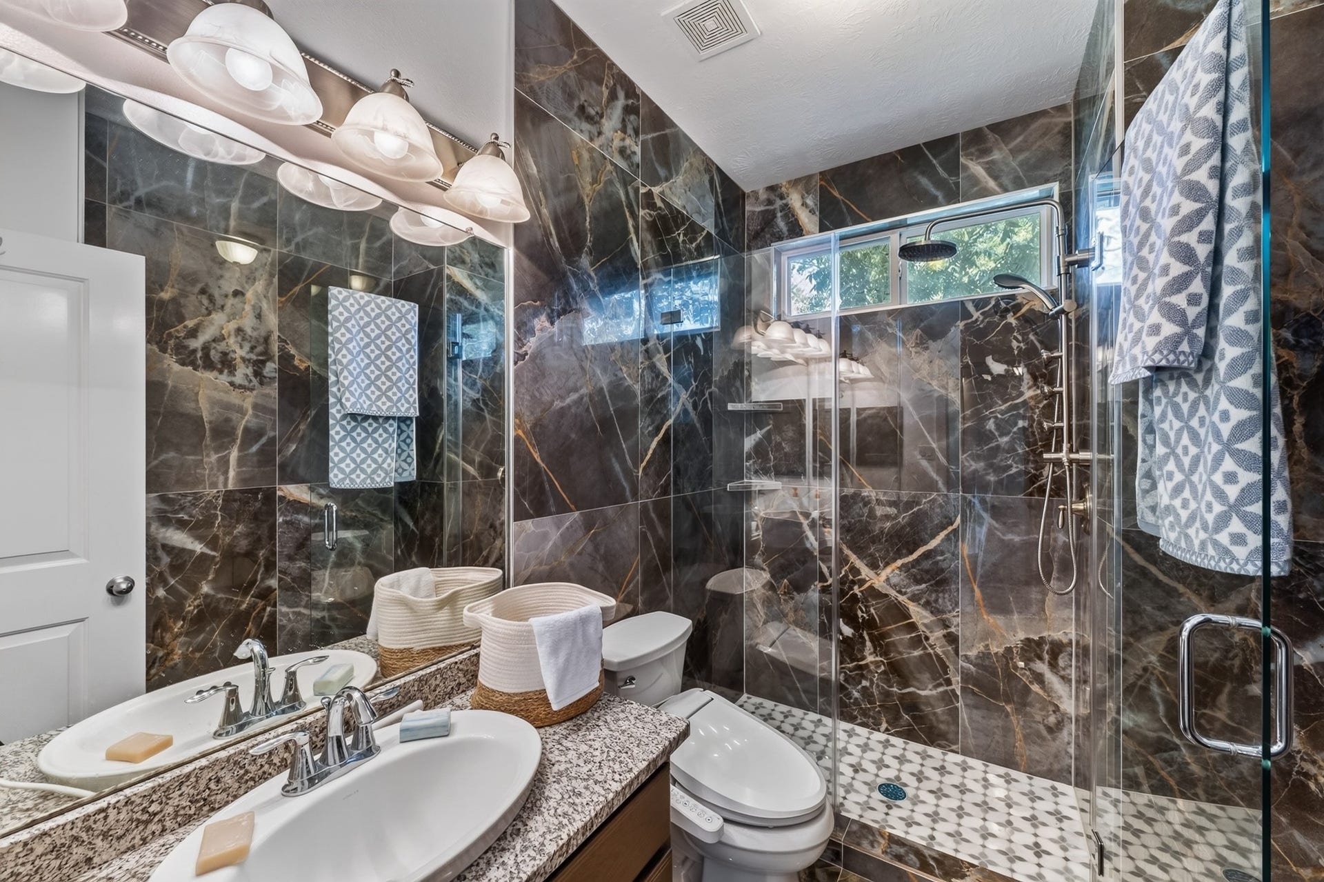 Upstairs bathroom with marble.