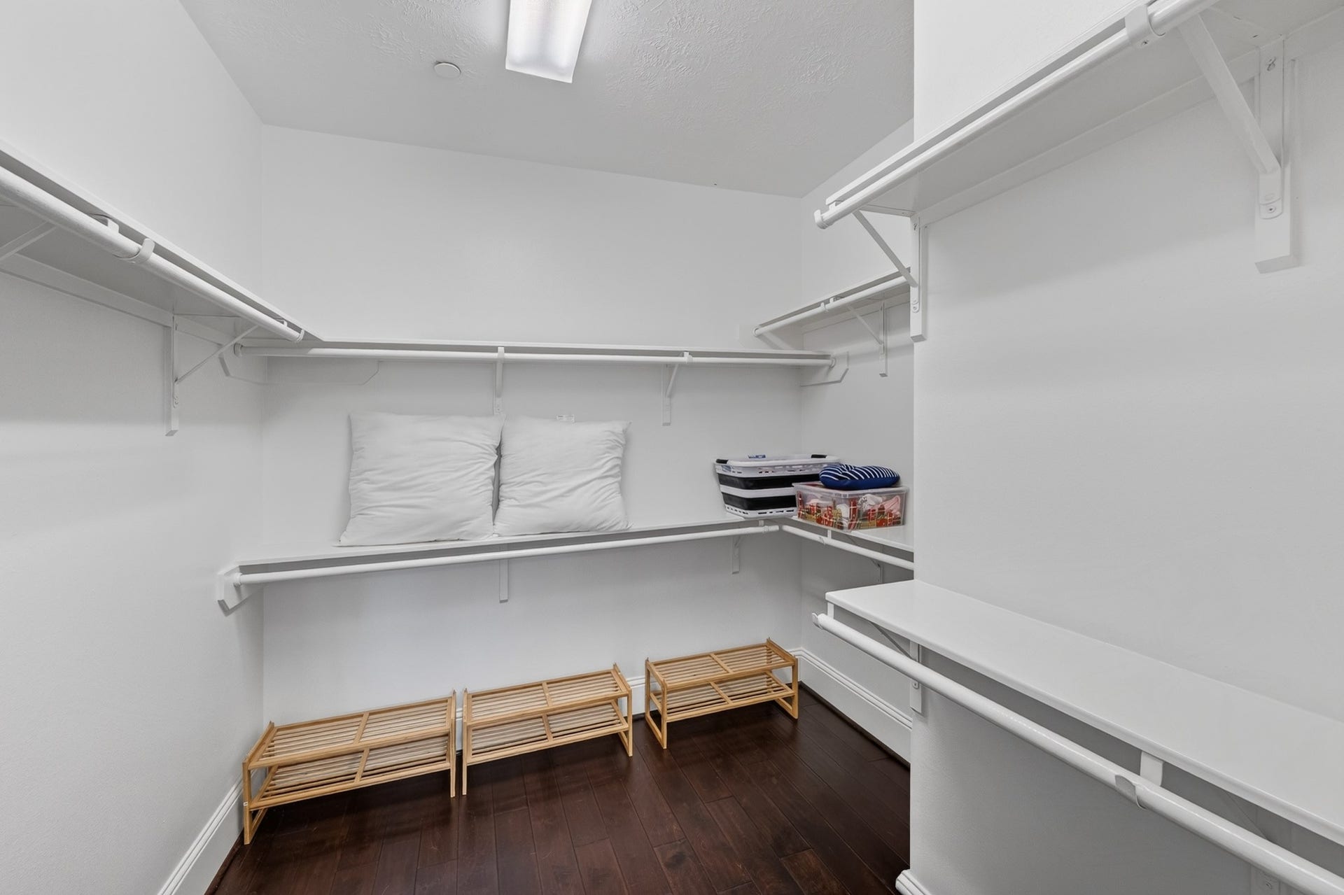 Upstairs Primary bedroom custom walk-in closet.