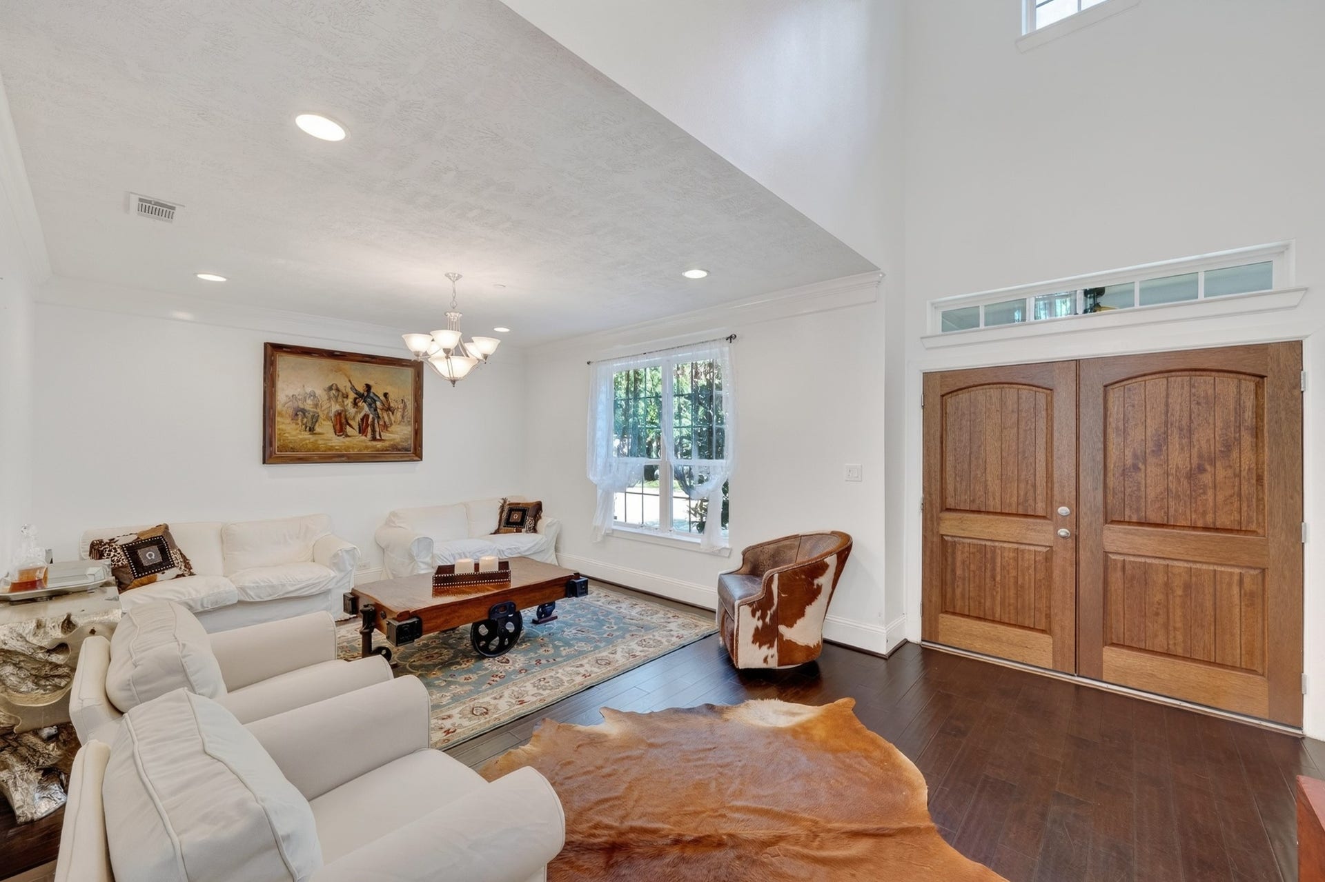 Formal dining room with soaring ceiling and custom millwork