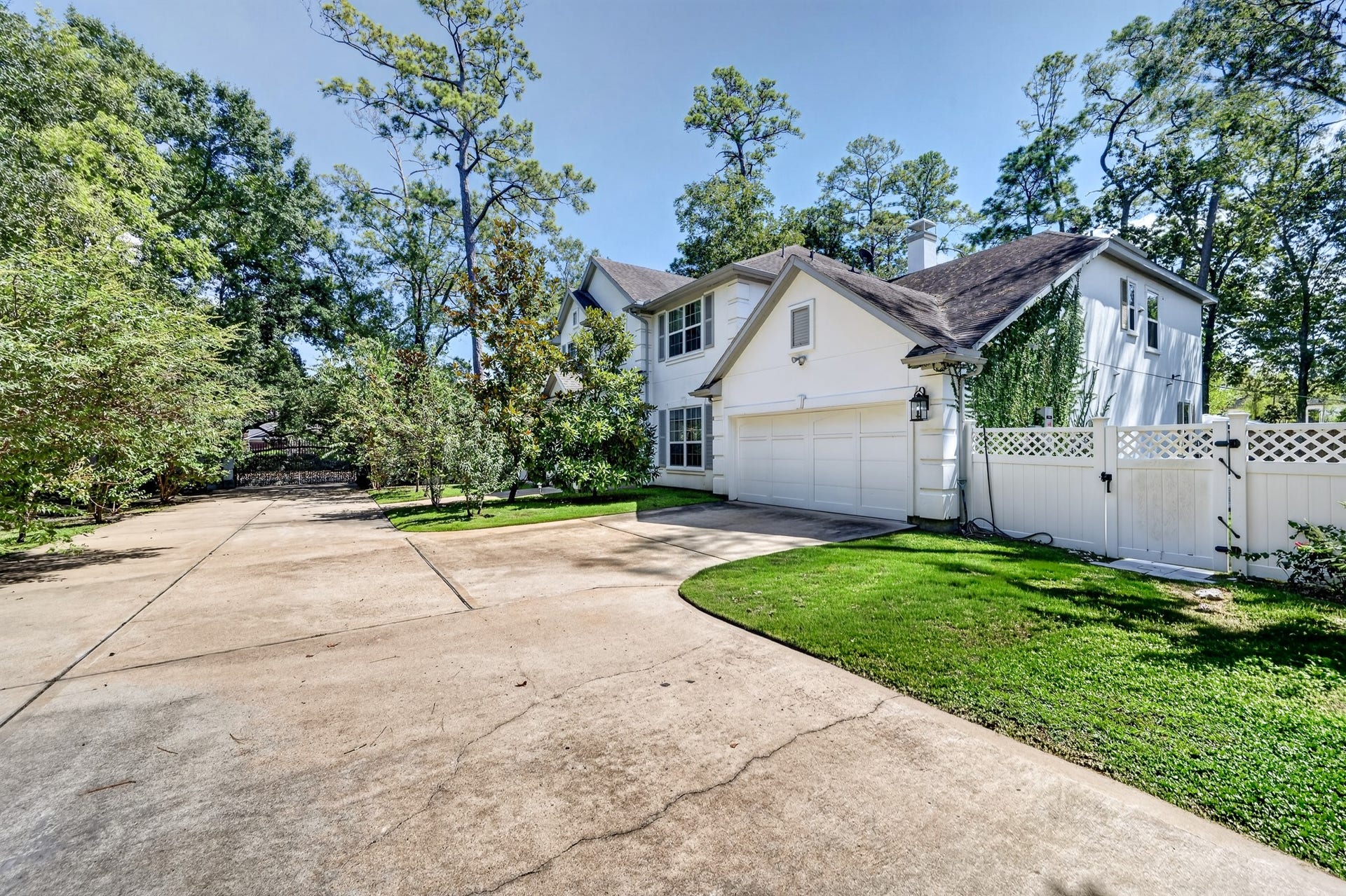 Generous motor court with ample parking and access to the detached garage.