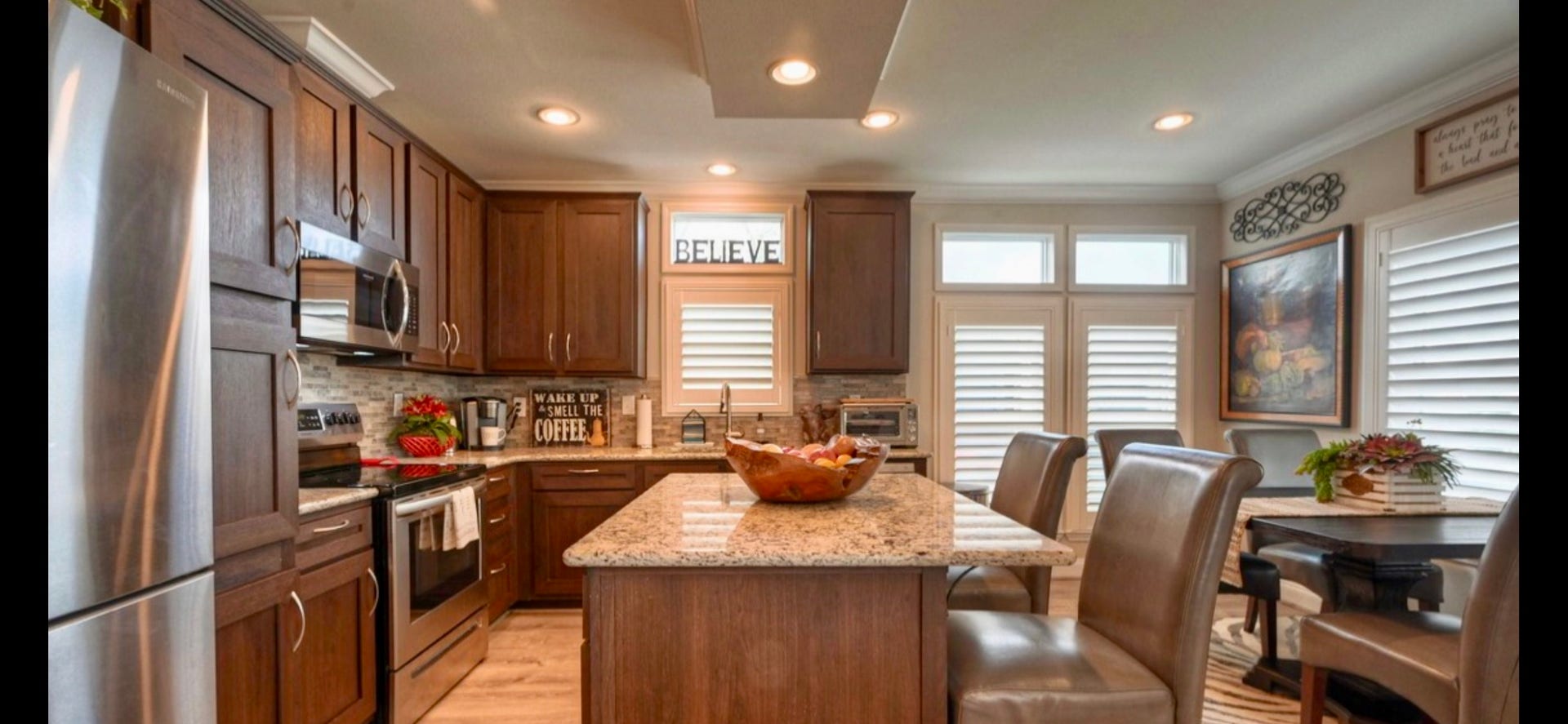 11720 Thousand Trails Road, #73, Willis, TX 77318 Open kitchen connects to the living area & features Frigidaire appliances, a pantry, breakfast bar & ample cabinetry. Refrigerator included.