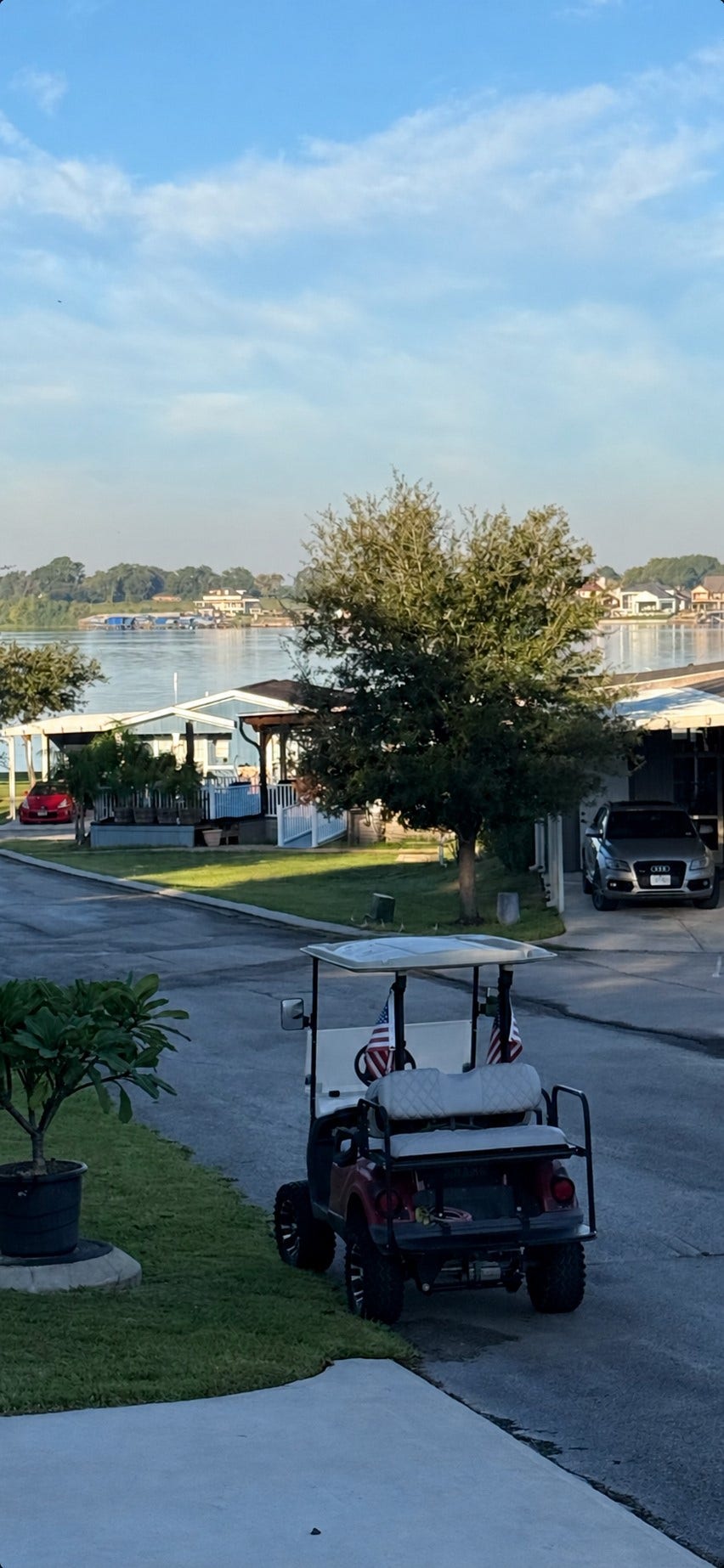 11720 Thousand Trails Road, #73, Willis, TX 77318 Enjoy views of Lake Conroe from the homes front porcha relaxing backdrop for morning coffee or unwinding at the end of the day.