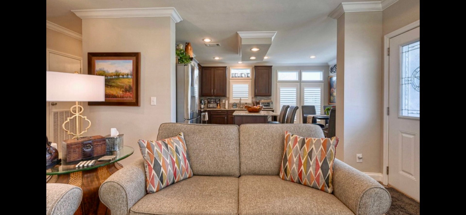 11720 Thousand Trails Road, #73, Willis, TX 77318 Open kitchen/living layout creates an easy flow for everyday living & entertaining, complemented by upgraded flooring & coordinated finishes throughout.