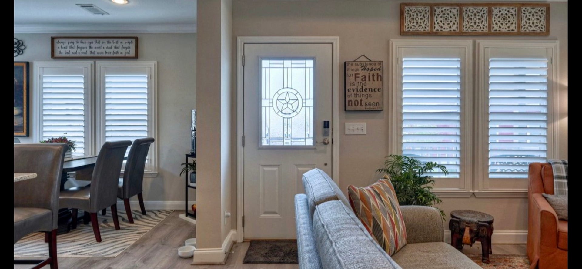11720 Thousand Trails Road, #73, Willis, TX 77318 Open living/dining area features upgraded laminate flooring, windows with shutters & easy access to the front entry.