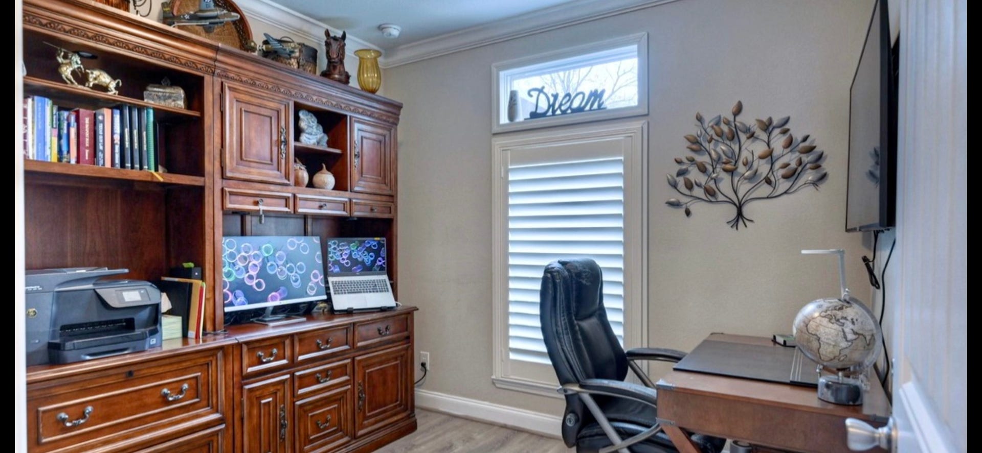 11720 Thousand Trails Road, #73, Willis, TX 77318 Another view of the secondary bedroom highlights its versatility, shown with a desk & shelving for a home office setup.
