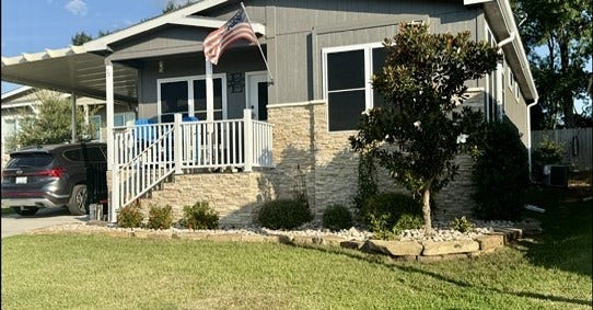 11720 Thousand Trails Road, #73, Willis, TX 77318 Landscaped flower beds, stone accents & a welcoming covered porch enhance the exterior. Front solar screens & a sprinkler system add everyday convenience.