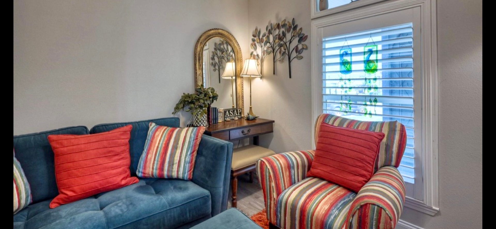 11720 Thousand Trails Road, #73, Willis, TX 77318 Secondary bedroom offers flexible space for guests or hobbies, with a ceiling fan & shuttered window.