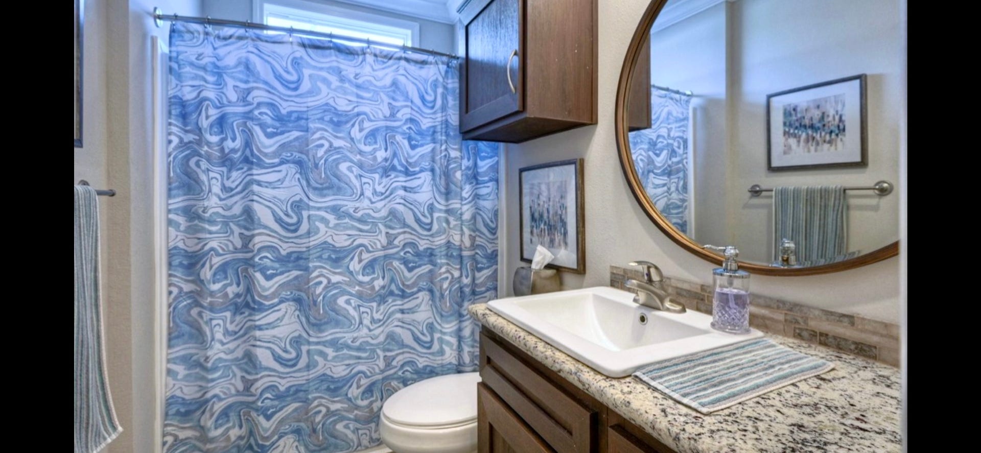 11720 Thousand Trails Road, #73, Willis, TX 77318 Secondary bath features a tub/shower combination, vanity storage & coordinating finishes.