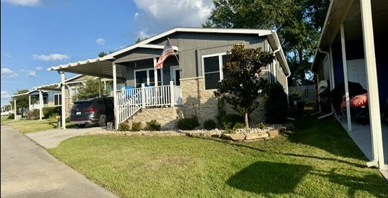 11720 Thousand Trails Road, #73, Willis, TX 77318 Enjoy Lake Conroe area living in this upgraded 2019 home featuring 2 bedrooms, 2 baths, a covered front porch & attached carport. Home only; land leased. Thousand Trails membership required.