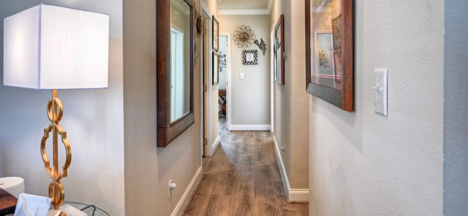 11720 Thousand Trails Road, #73, Willis, TX 77318 Upgraded flooring continues through the hallway, connecting the main living area to the bedrooms & baths.