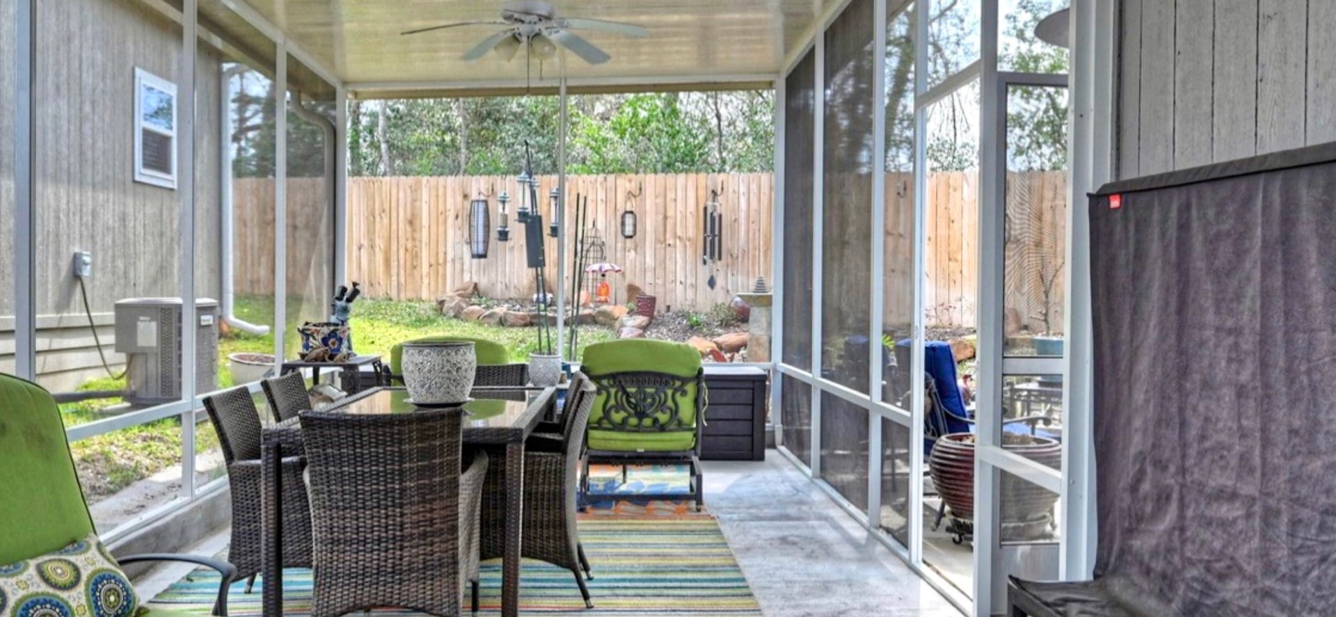 11720 Thousand Trails Road, #73, Willis, TX 77318 Extended screened-in room provides additional space for seating, dining & enjoying the outdoors, complete with a ceiling fan.