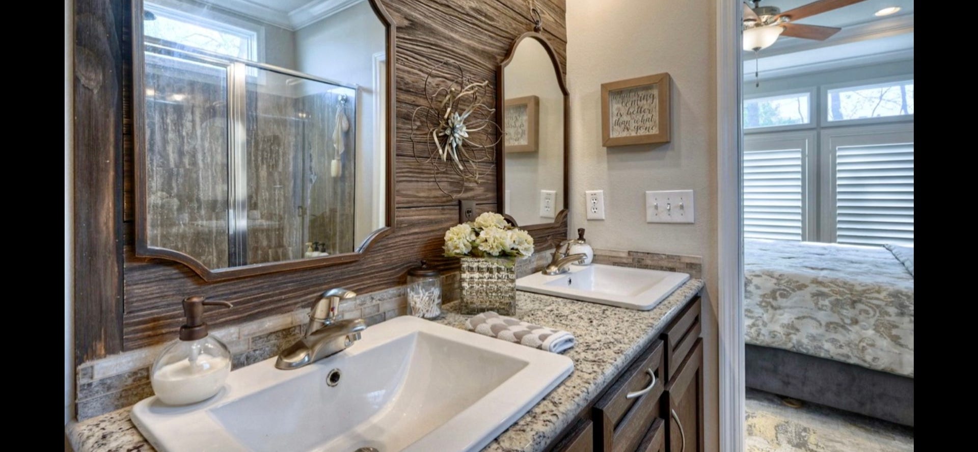 11720 Thousand Trails Road, #73, Willis, TX 77318 Primary bath offers double sinks, generous vanity storage & natural light through a shuttered window.