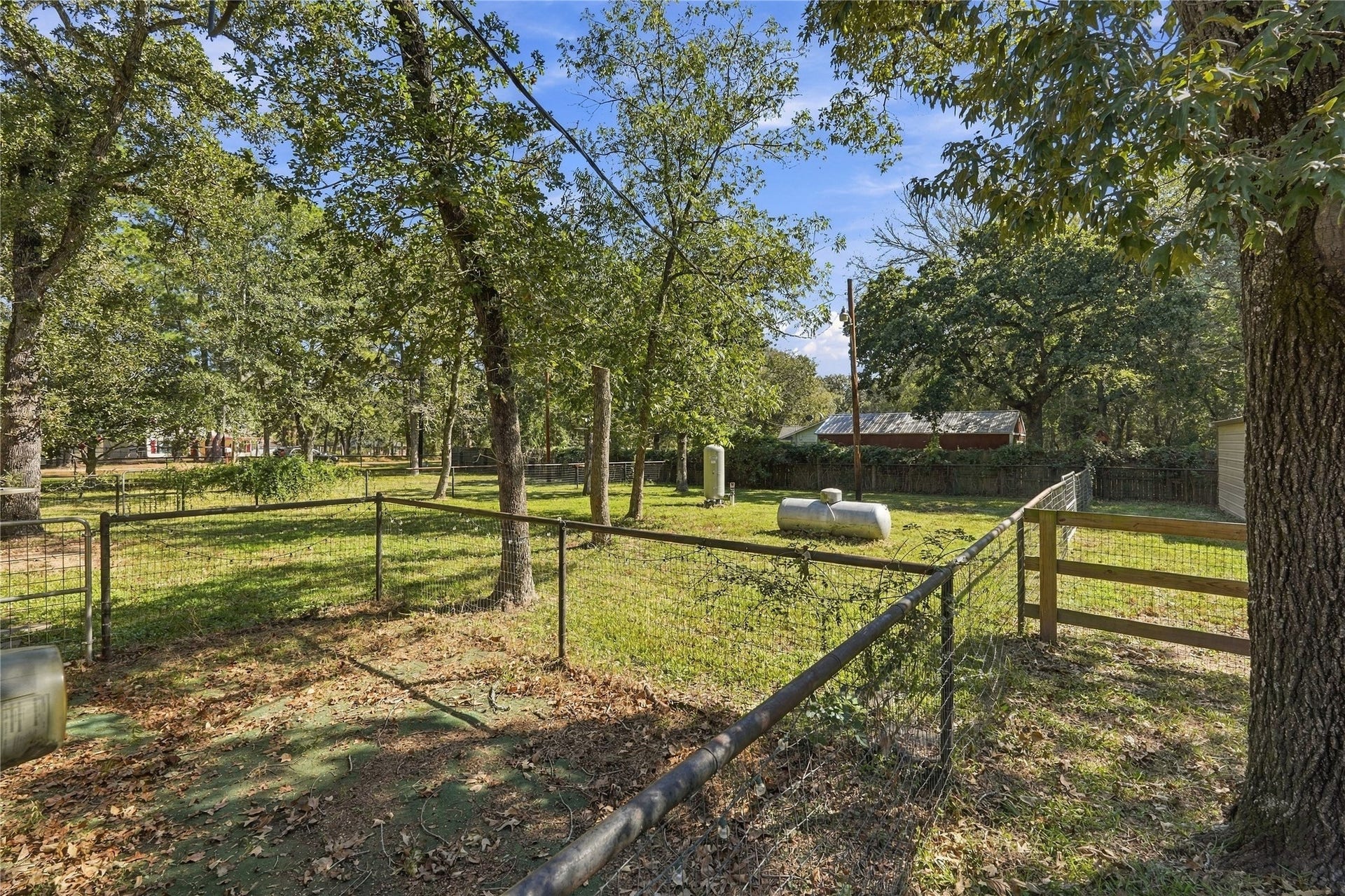 24904 Robin Hood Lane, Hockley, TX 77447 Additional fenced areas provide versatile outdoor space with mature trees and room for a variety of uses.