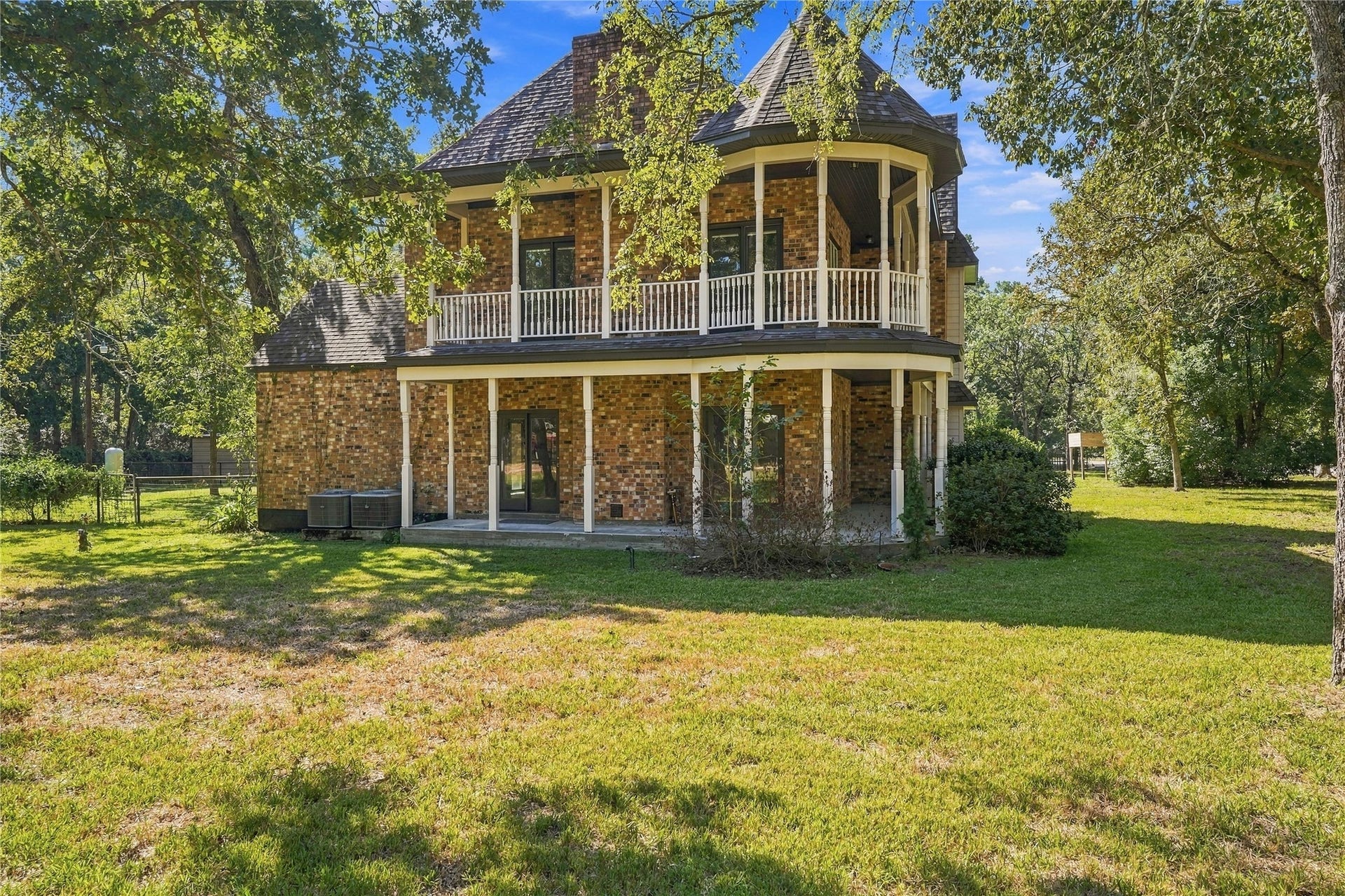 24904 Robin Hood Lane, Hockley, TX 77447 Charming two-story home with covered lower patio and upper-level balcony overlooking the spacious, wooded grounds.