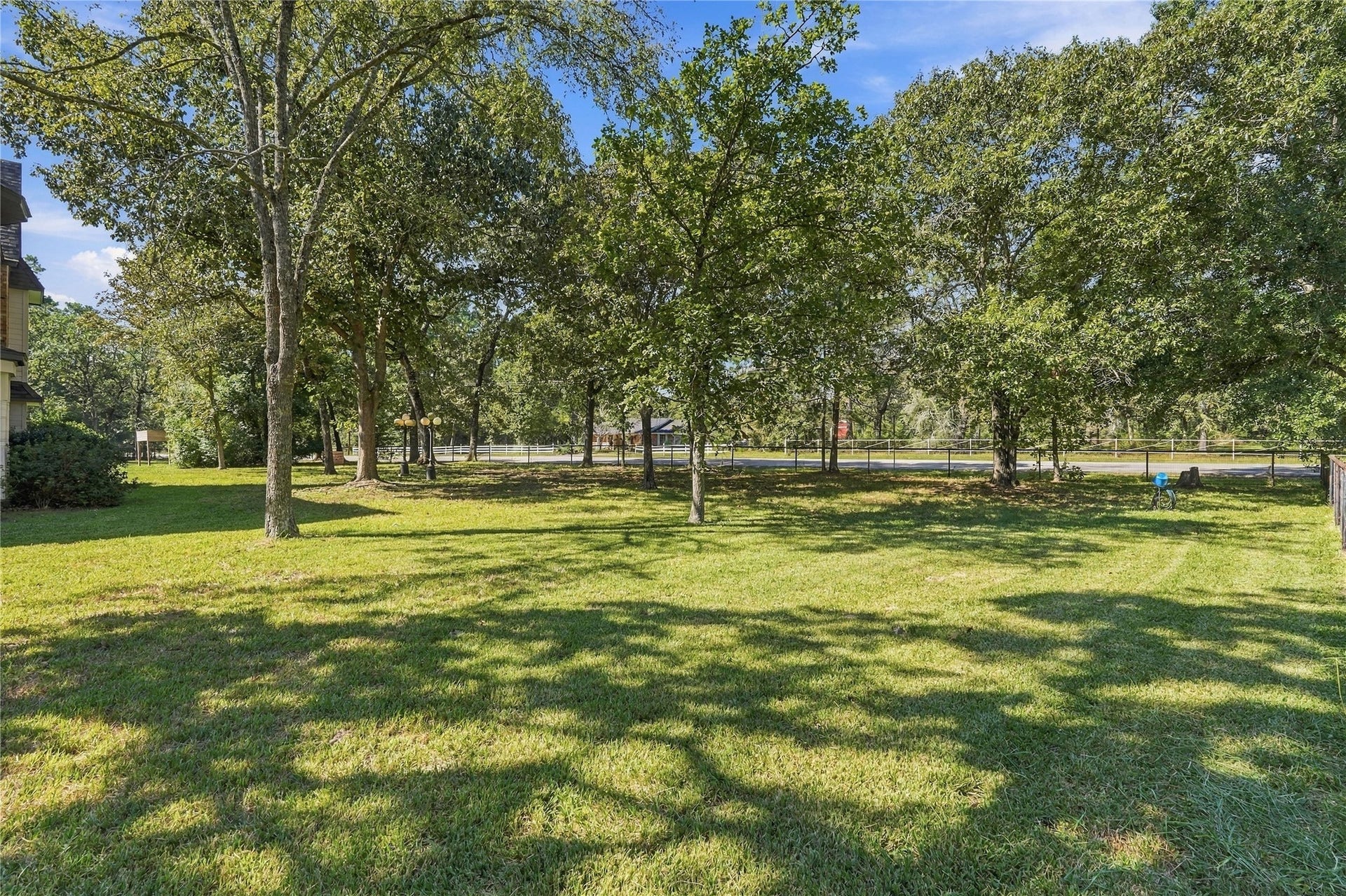 24904 Robin Hood Lane, Hockley, TX 77447 Spacious, tree-shaded yard with mature trees, open green space, and plenty of room to enjoy the outdoors.