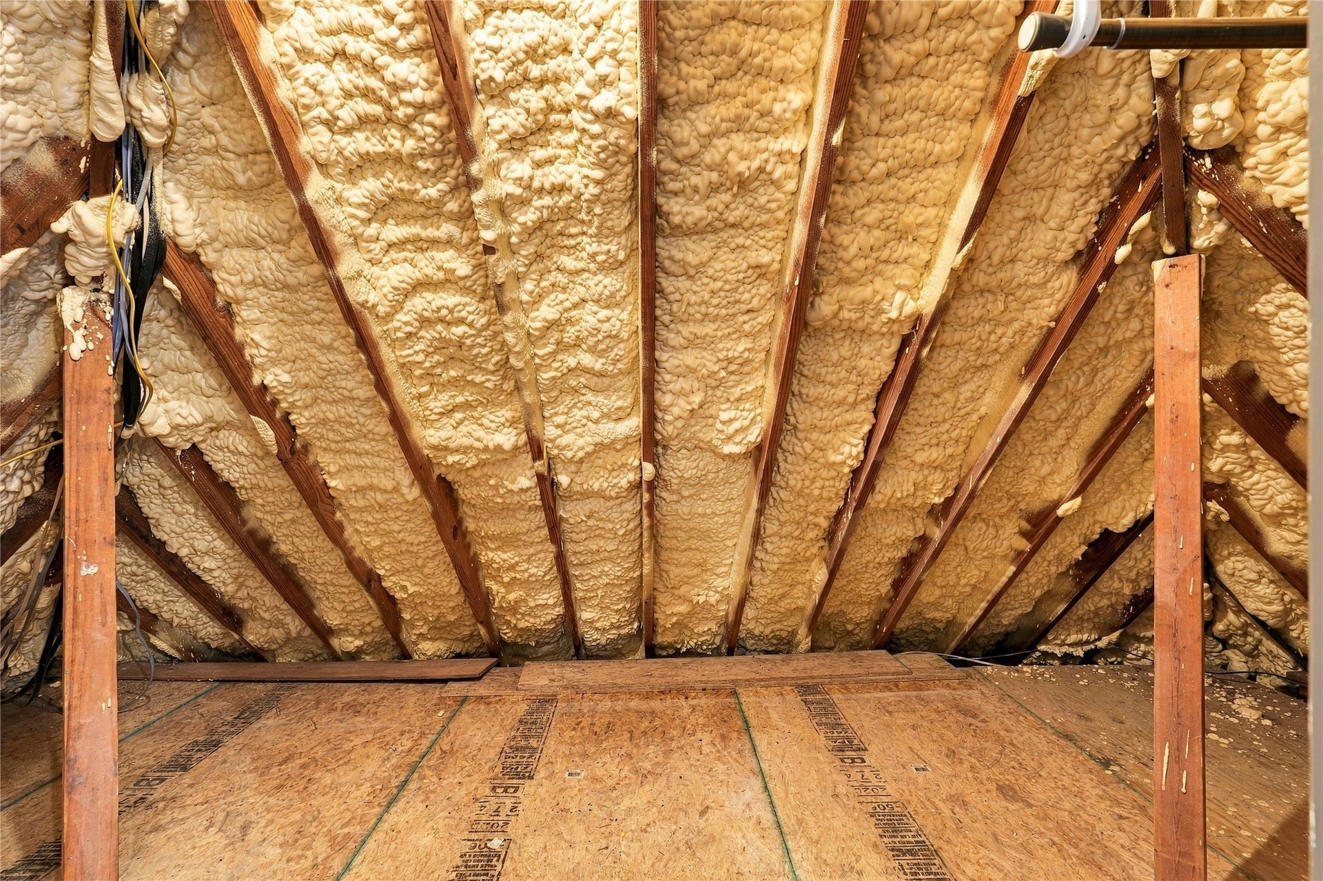 24904 Robin Hood Lane, Hockley, TX 77447 Attic storage area featuring spray foam insulation and wood decking for additional storage.