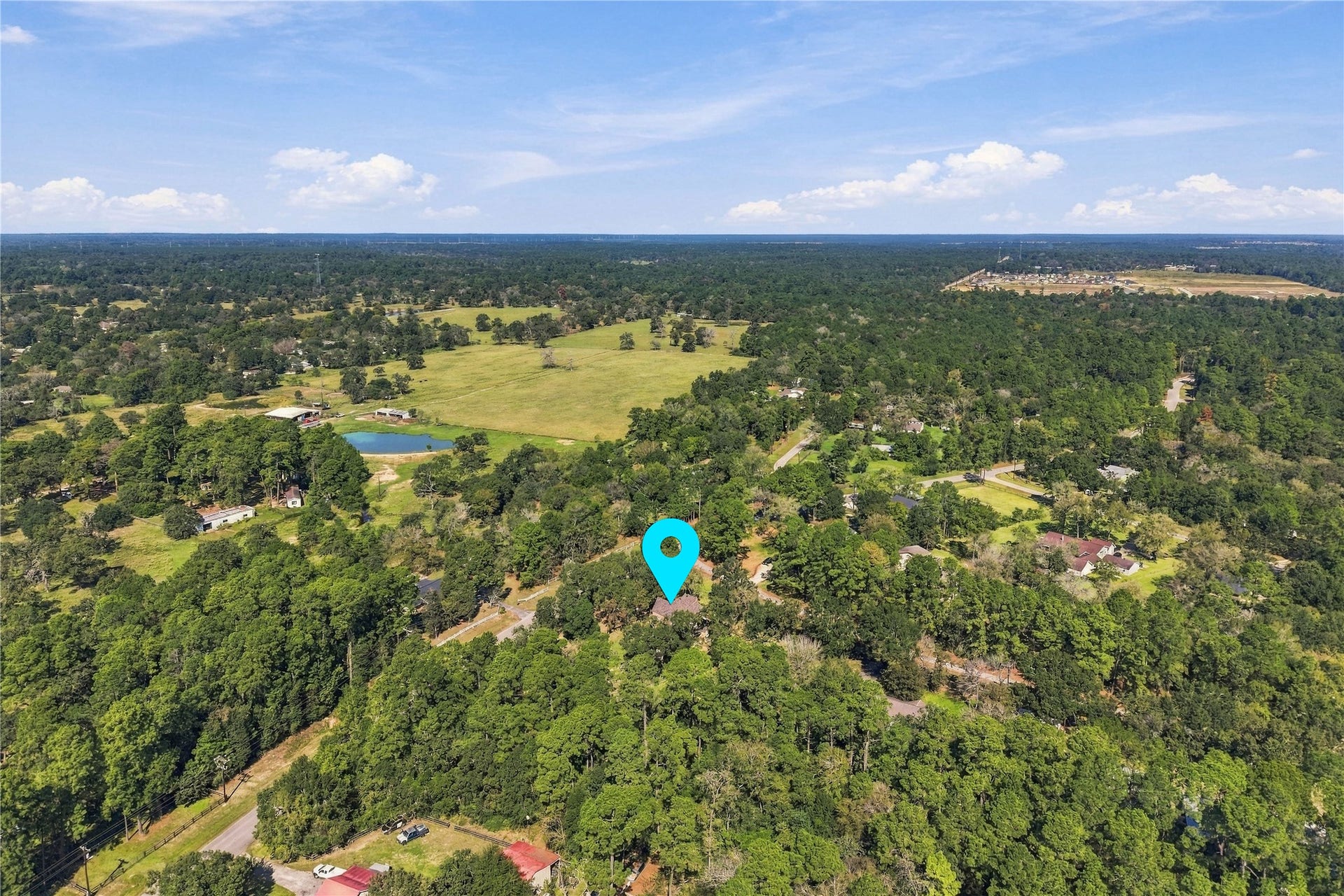 24904 Robin Hood Lane, Hockley, TX 77447 Aerial view highlighting the property's location among mature trees and the surrounding wooded landscape of Hockley.
