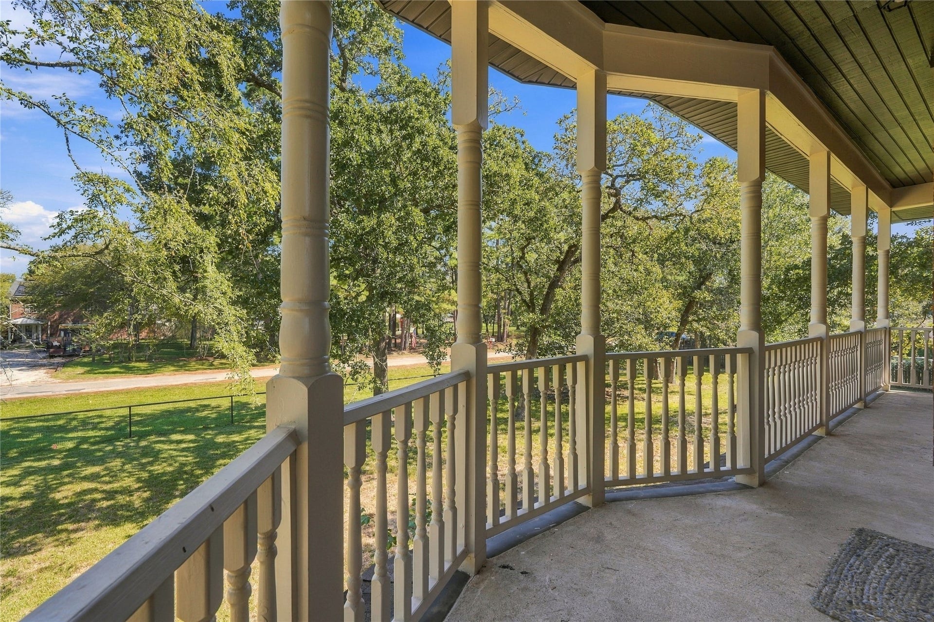 24904 Robin Hood Lane, Hockley, TX 77447 Additional balcony view showcasing the generous outdoor space and scenic, tree-lined surroundings.