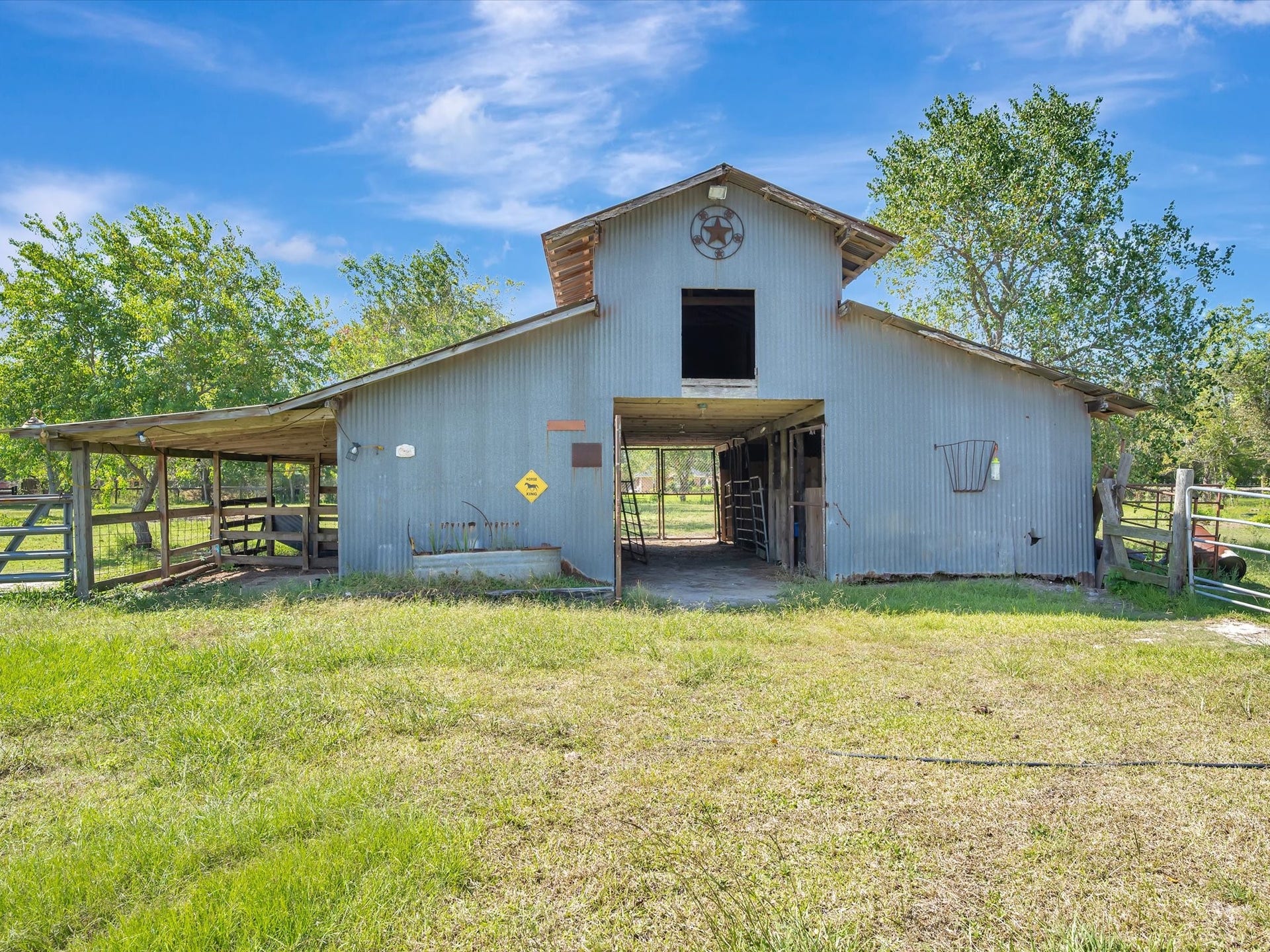 7230 Avenue L, Santa Fe, TX 77510 Barn with hay loft; animals welcome.