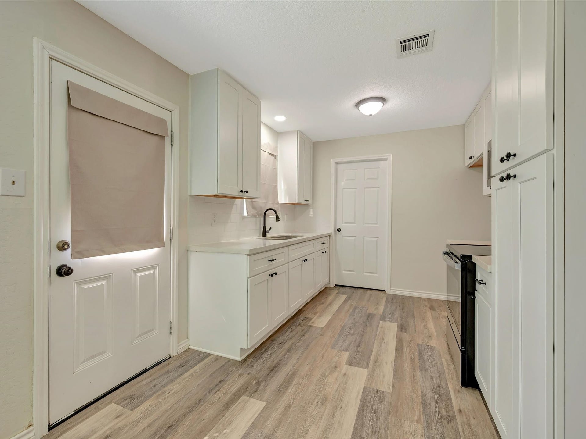 7230 Avenue L, Santa Fe, TX 77510 Open concept kitchen flowing seamlessly into the dining area. a