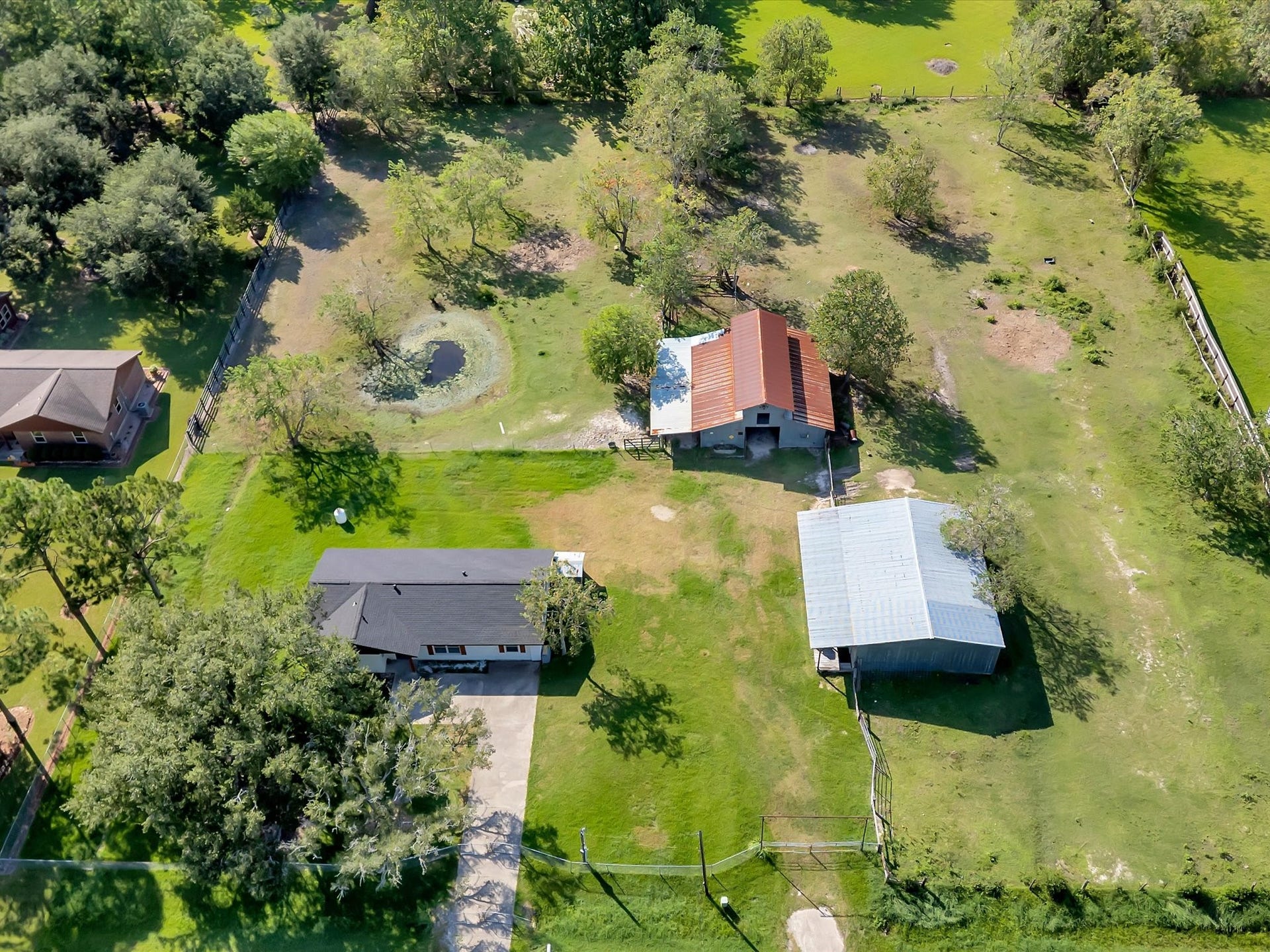 7230 Avenue L, Santa Fe, TX 77510 Spacious 1.9-acre property featuring beautifully fenced pastures and expansive views.