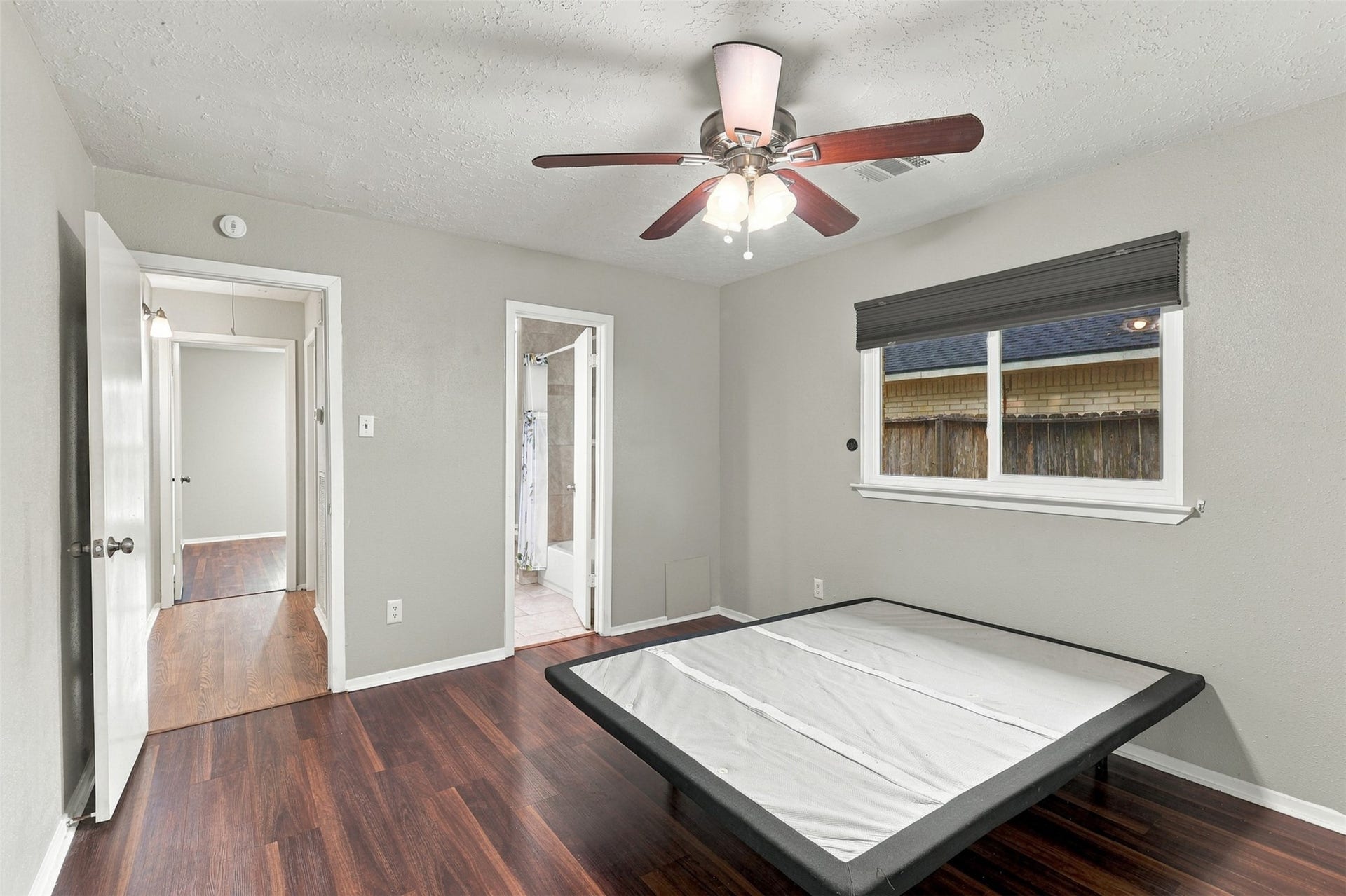 3011 Helmsley Drive, Pearland, TX 77584 Another primary bedroom view highlights the layout, ceiling fan, and wood-look flooring.