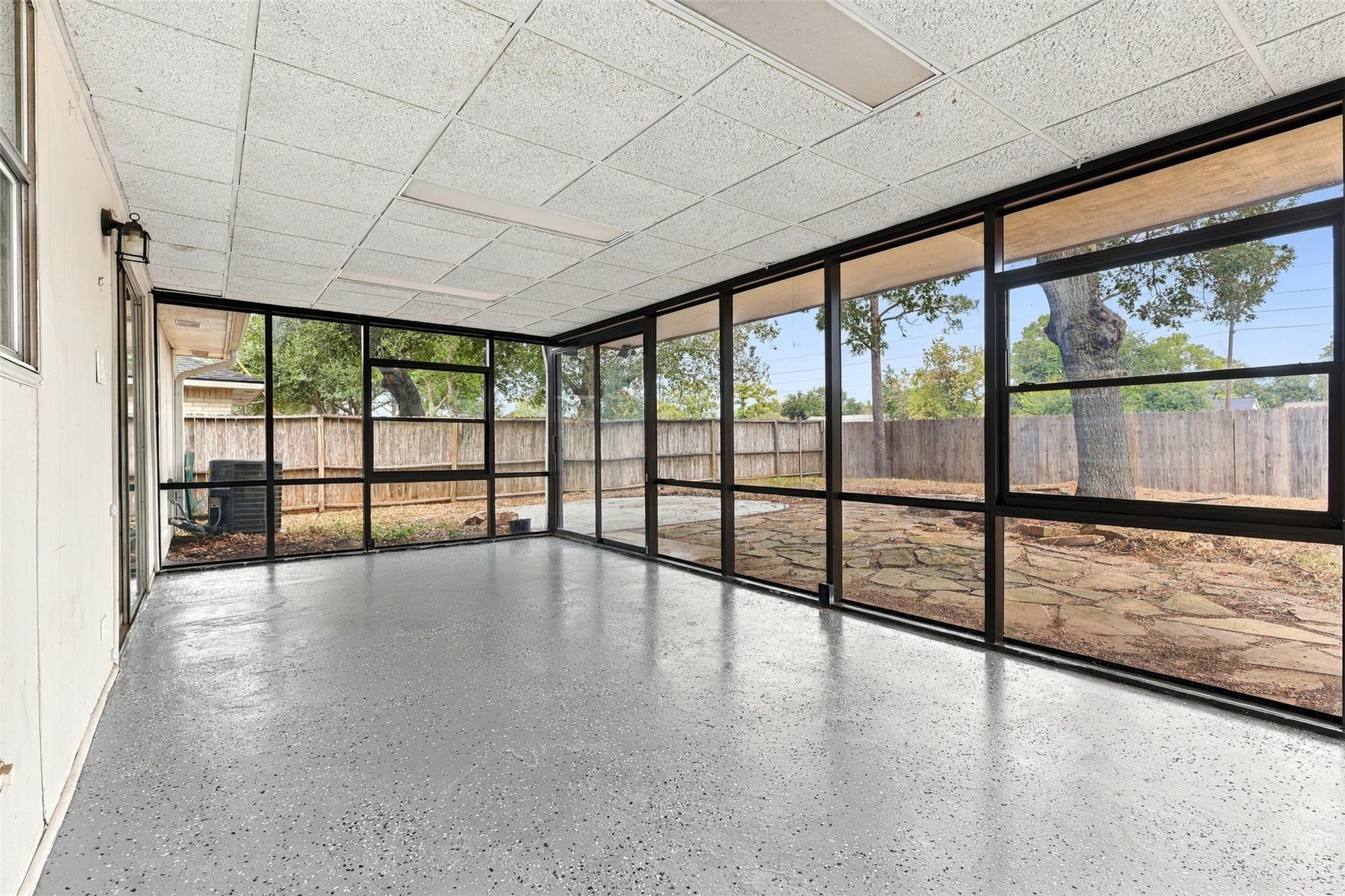 3011 Helmsley Drive, Pearland, TX 77584 The 230-square-foot sunroom features walls of windows and backyard viewsan inviting setting for a sitting area, hobbies, or a home office.