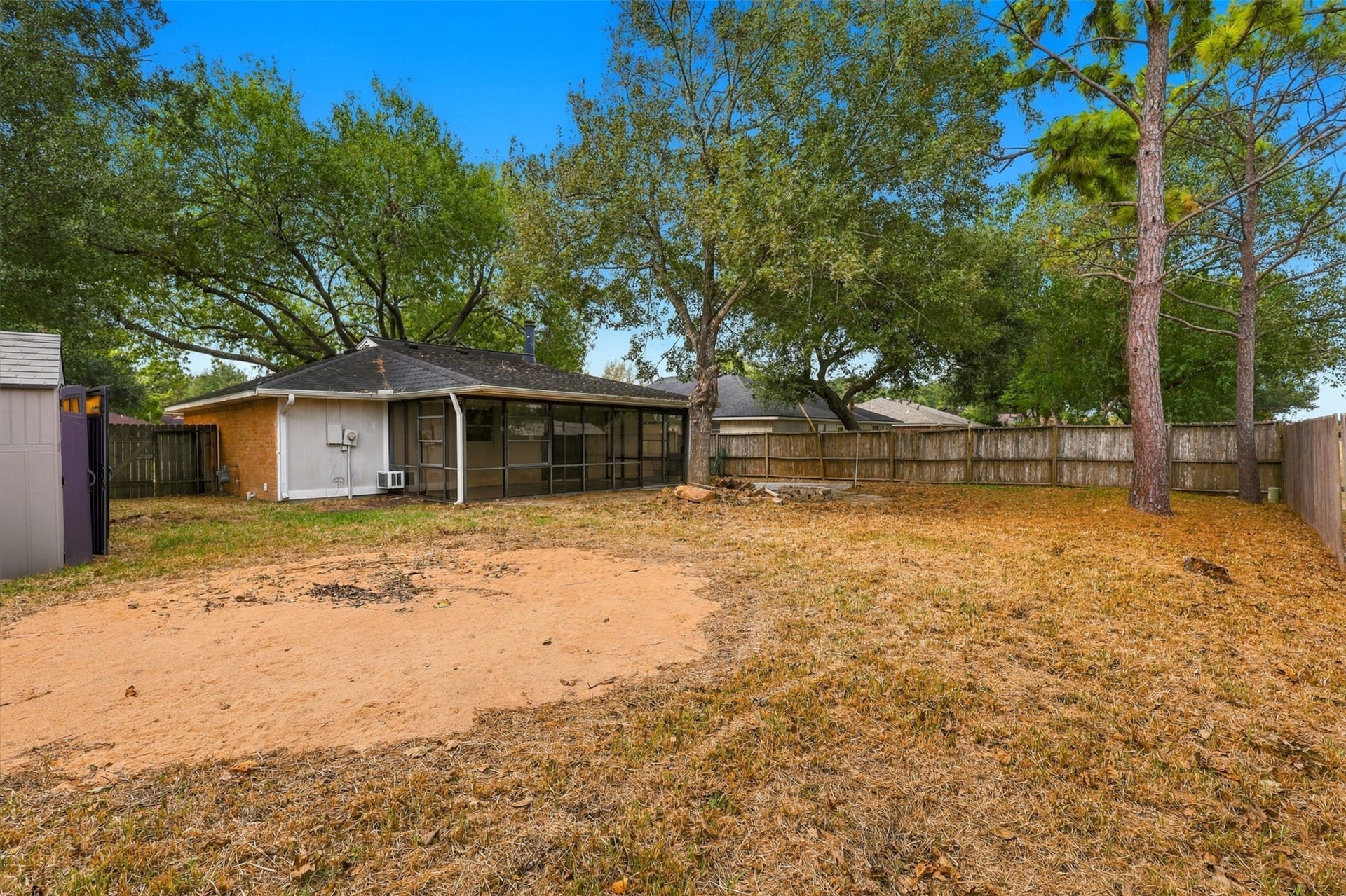3011 Helmsley Drive, Pearland, TX 77584 Another backyard perspective showcases the outdoor space and rear sunroom on this 7,645-square-foot lot.
