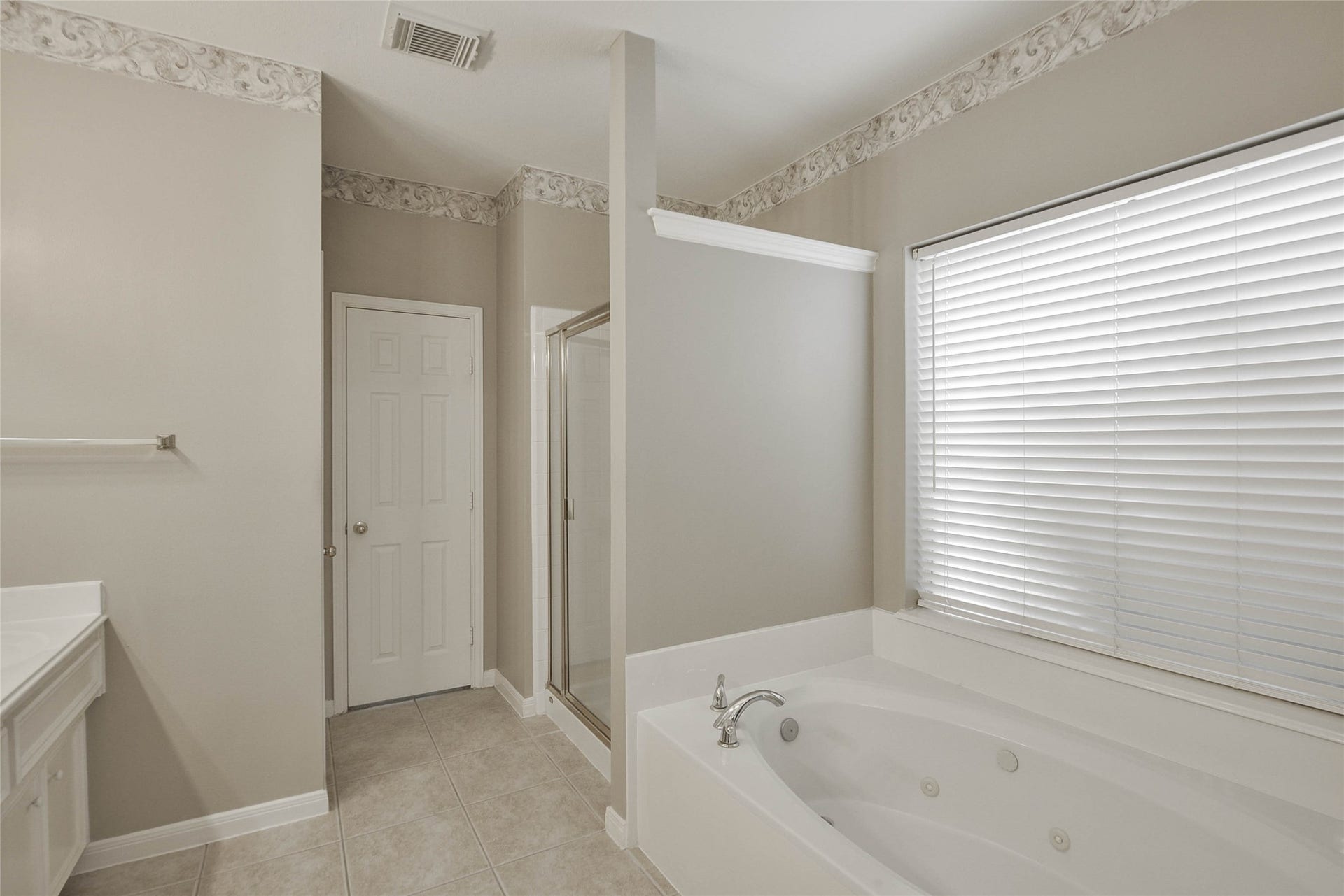 7023 Timber Edge Lane Lane, Humble, TX 77346 Primary Bathroom with jacuzzi tub and walk-in shower.