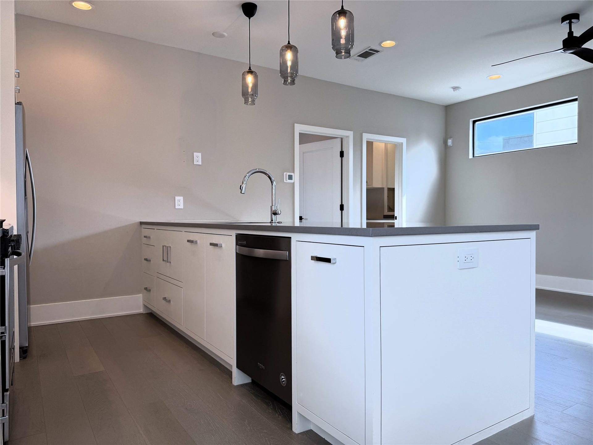 In the breakfast bar, there is a hidden microwave & a trash can cabinet. And, of course there is a dishwasher!