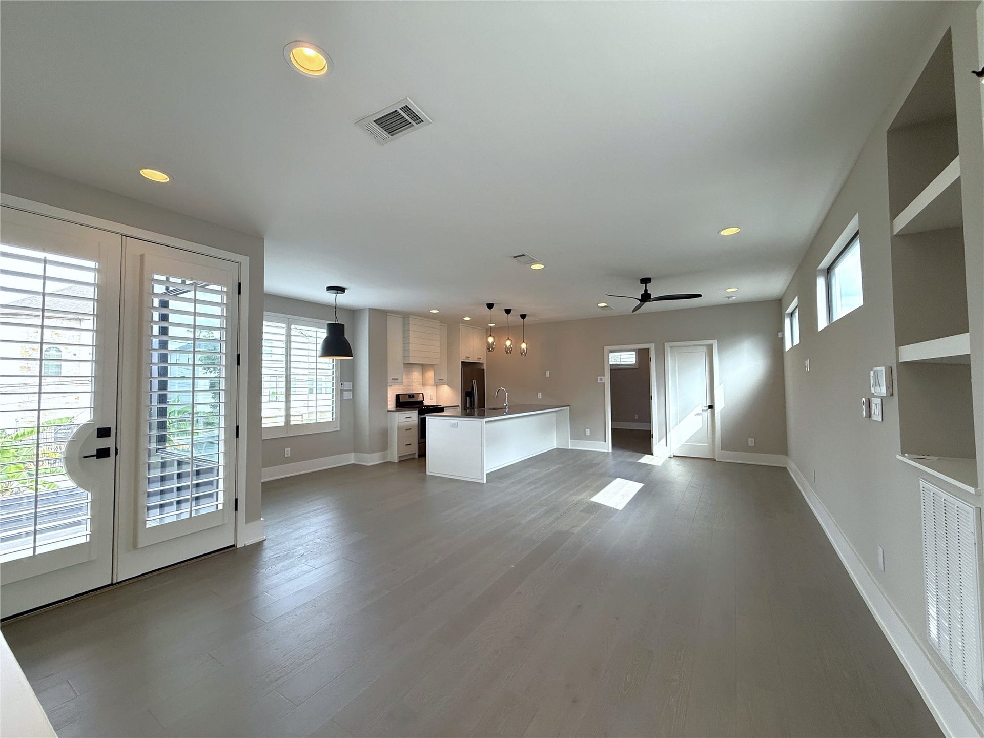 At the top of the stairway is your new home! Notice the plantation shutters and recessed lighting.
