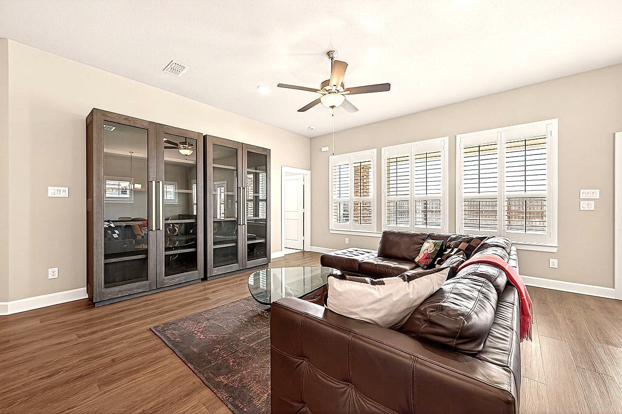 10010 Starry Night Lane, Manvel, TX 77578 Plantation shutters all around and refreshing natural light fills the home all around