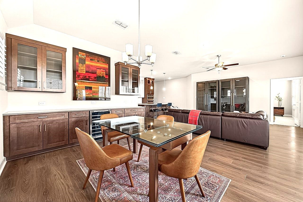 10010 Starry Night Lane, Manvel, TX 77578 Dining area with full access to living room and kitchen perfect for gatherings