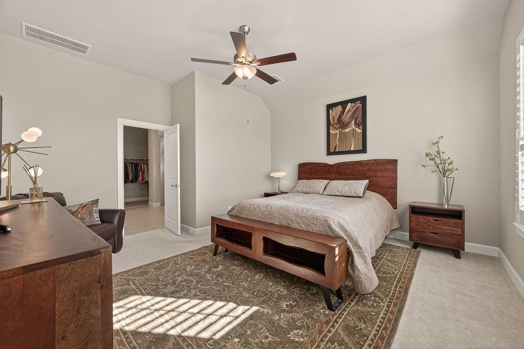 10010 Starry Night Lane, Manvel, TX 77578 Spacious primary suite with room for seating