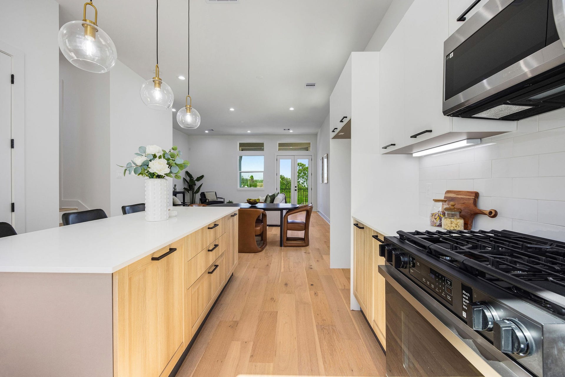 Another view of the large kitchen, equipped with Samsung stainless steel appliances.