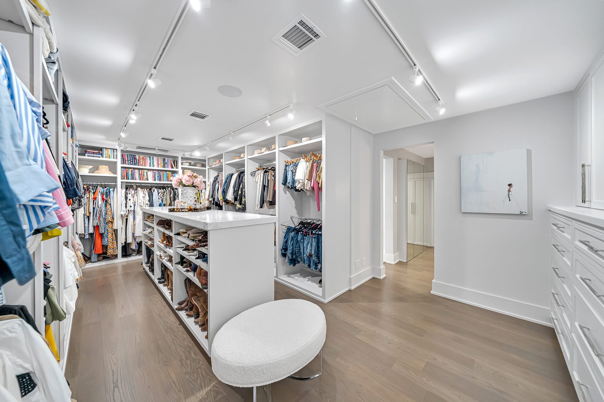 One of two generously sized walk-in closets offers exceptional space and organization.