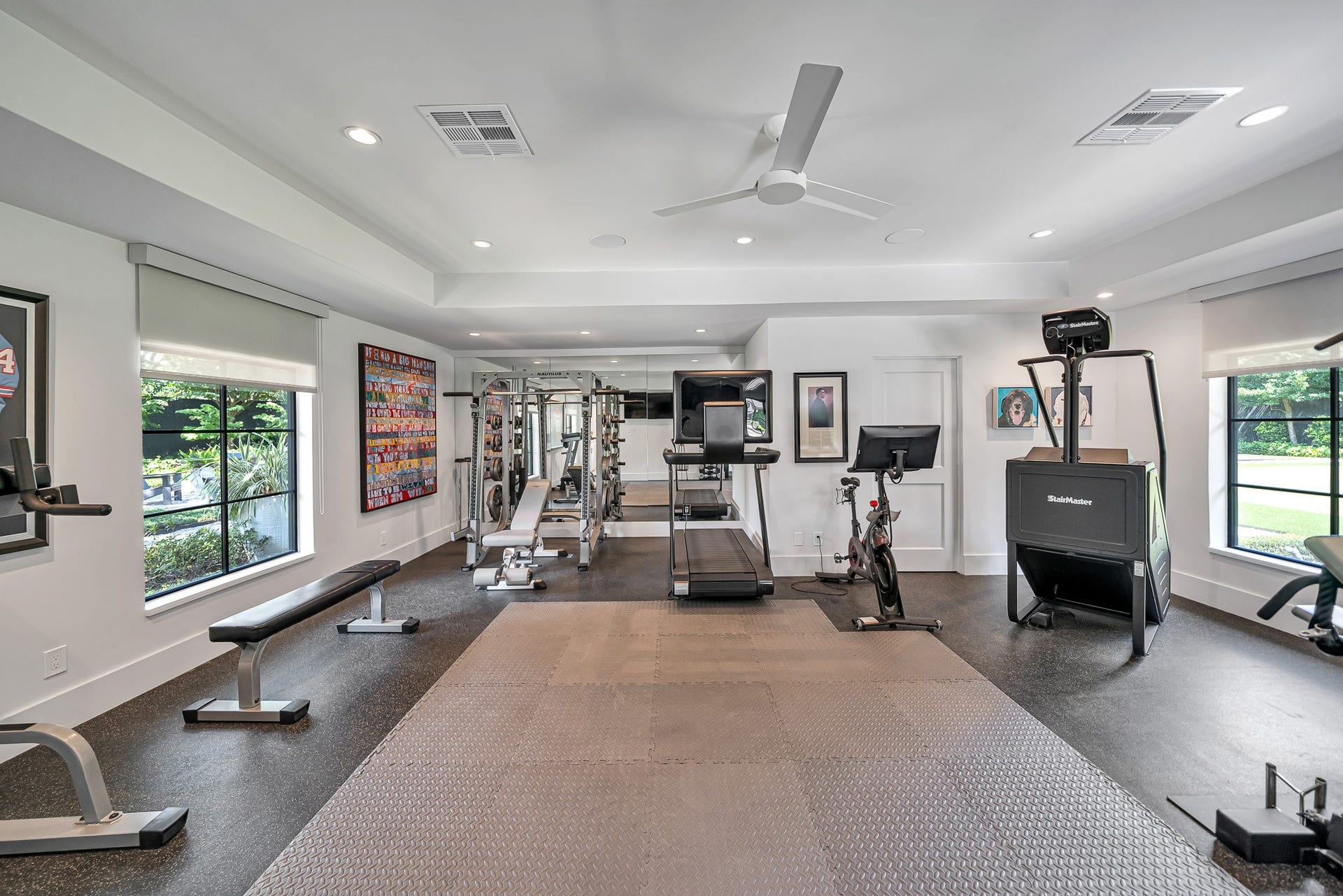 Fully equipped private home gym designed for complete fitness with a dedicated space for strength, cardio, and functional training.