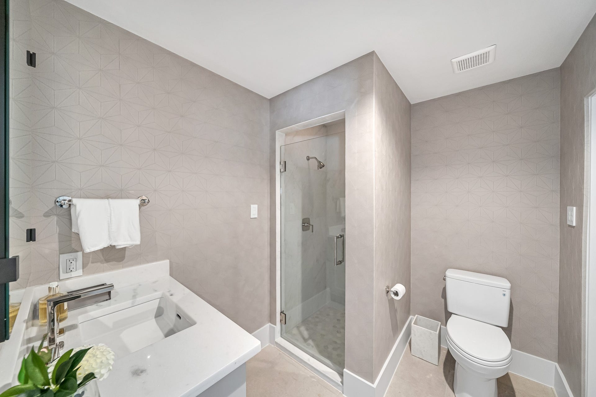 En-suite private bath with vanity and walk-in shower.