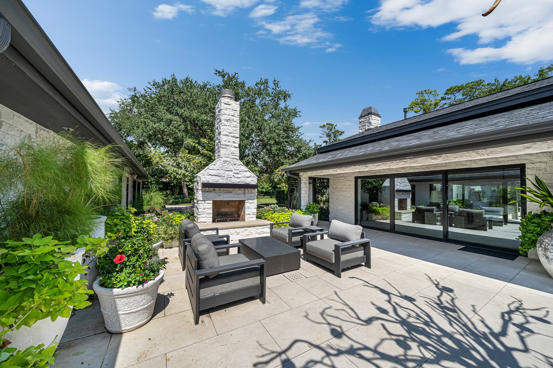 This outdoor retreat is centered around the main and guest house.
