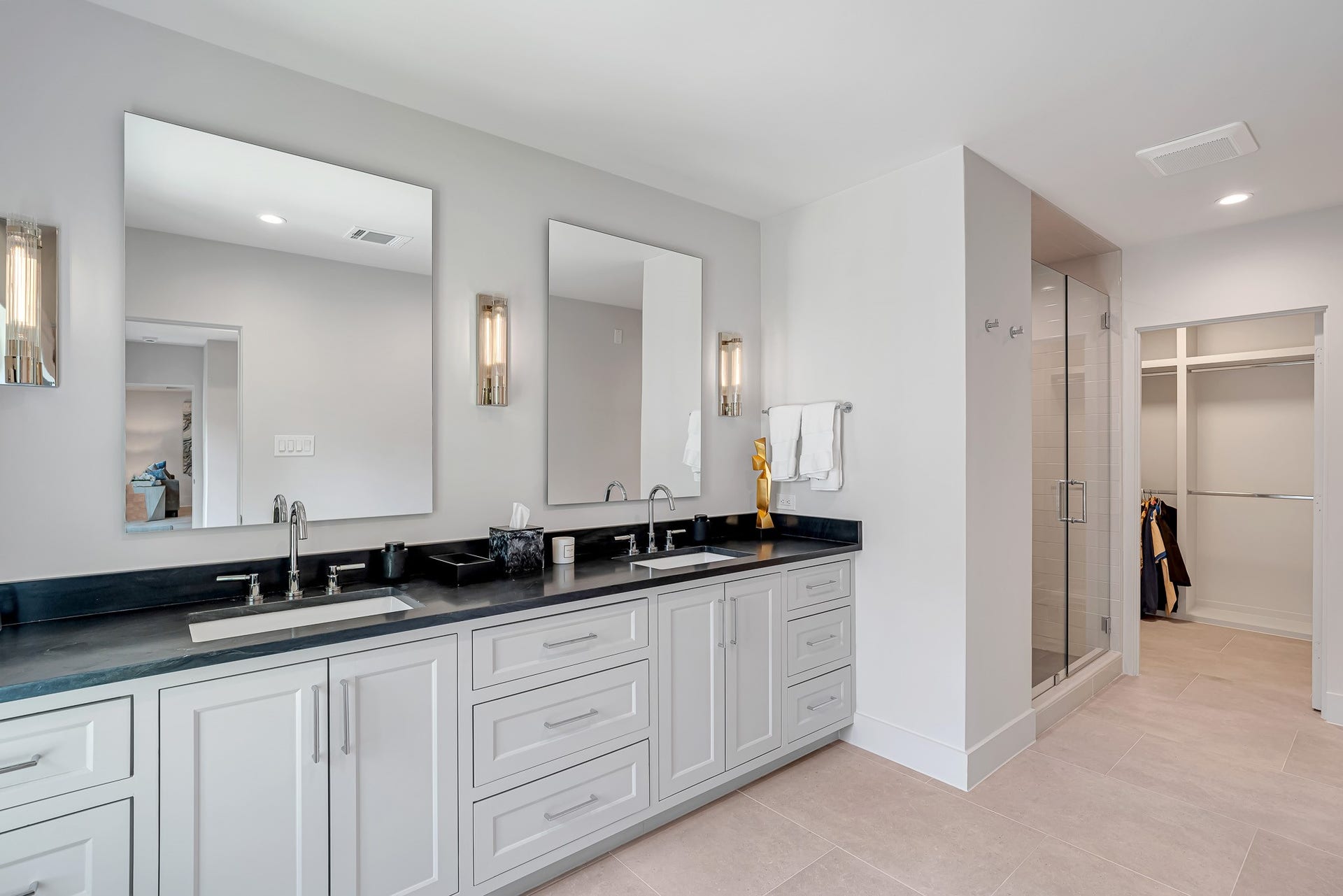 Guest suite bathroom with double vanity and walk -in closet.