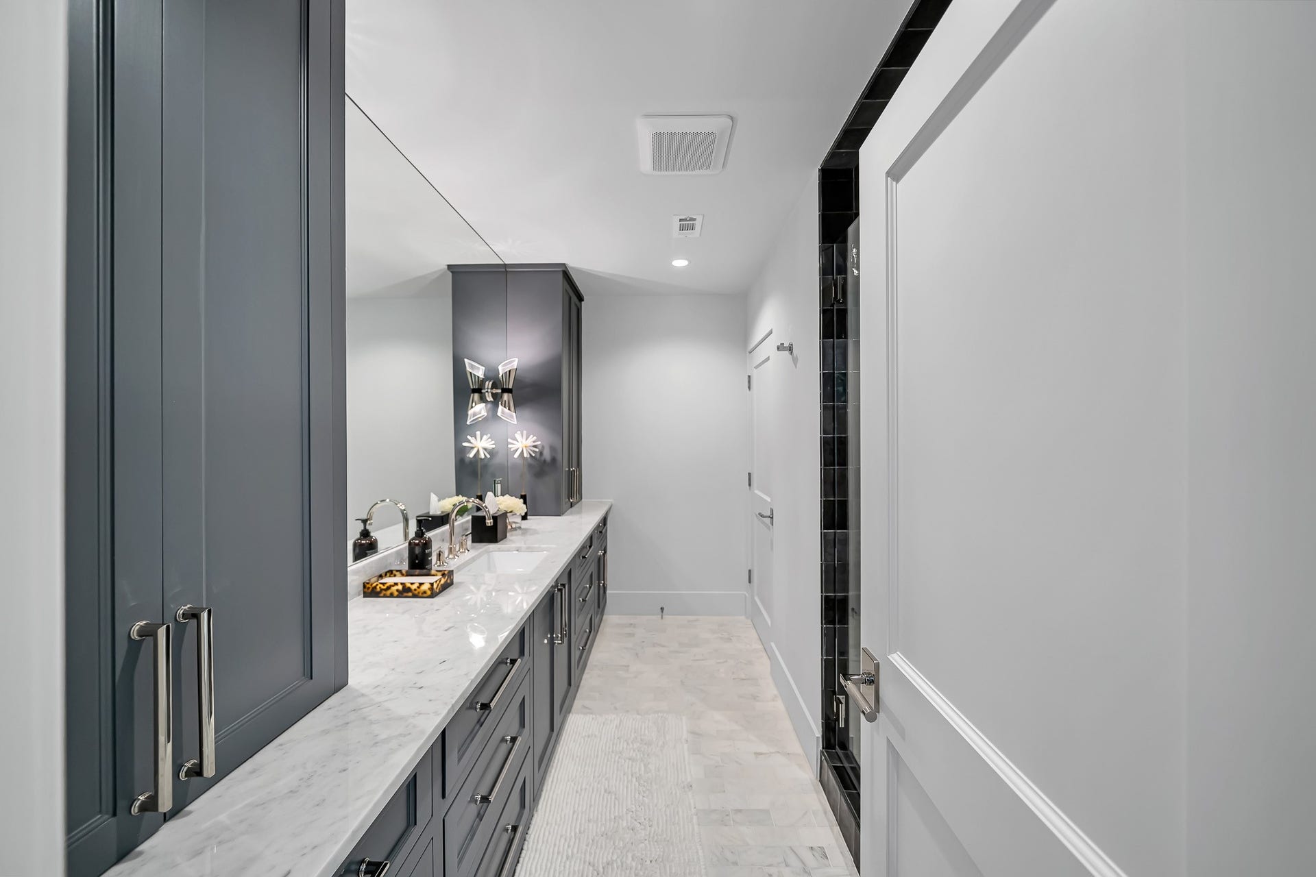 En-suite bathroom with vanity and walk-in shower.