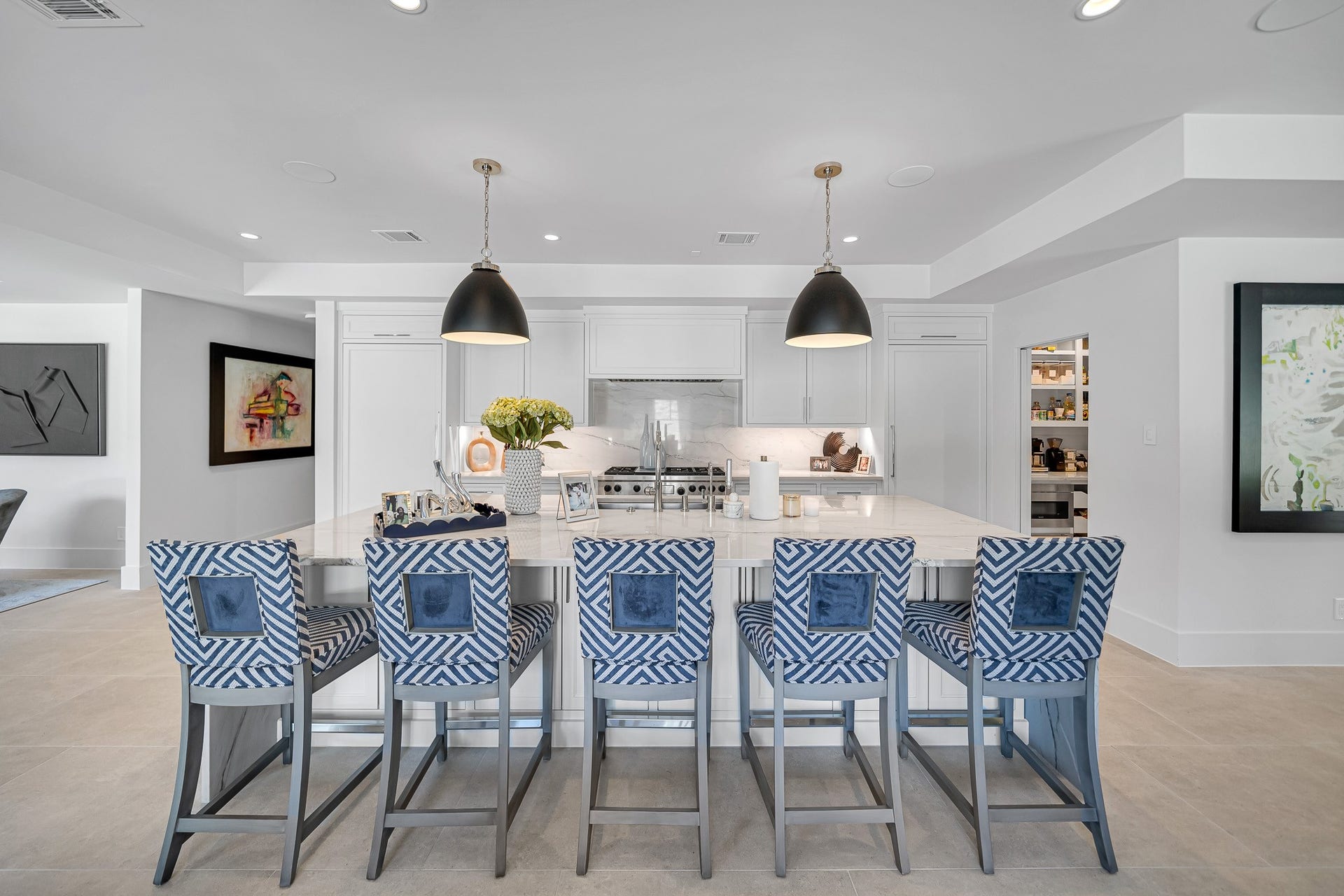 Chef's kitchen featuring high-quality appliances and pendant lighting, perfect for entertaining.
