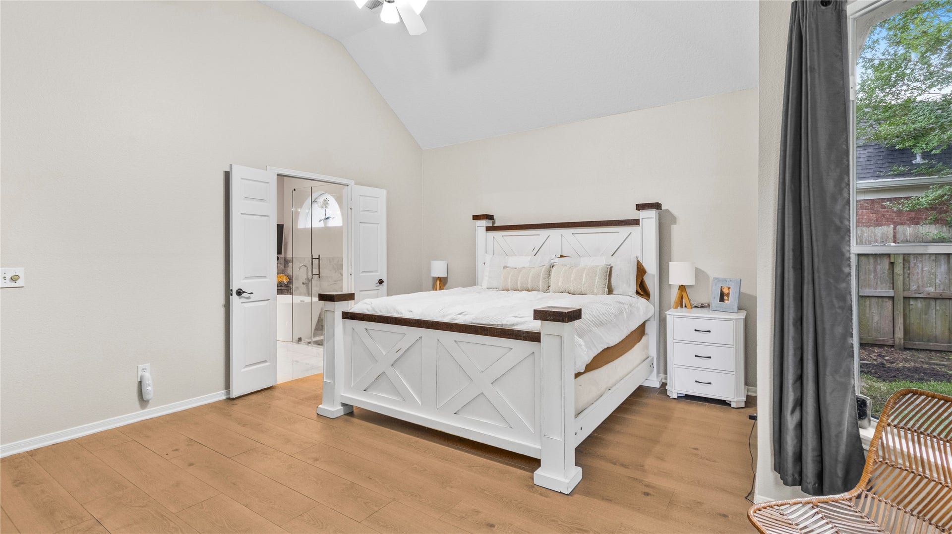 20214 Powerscourt Drive, Humble, TX 77346 Highlighting the suite's grand scale: soaring ceilings and rich hardwood floors lead through double doors into your private ensuite.