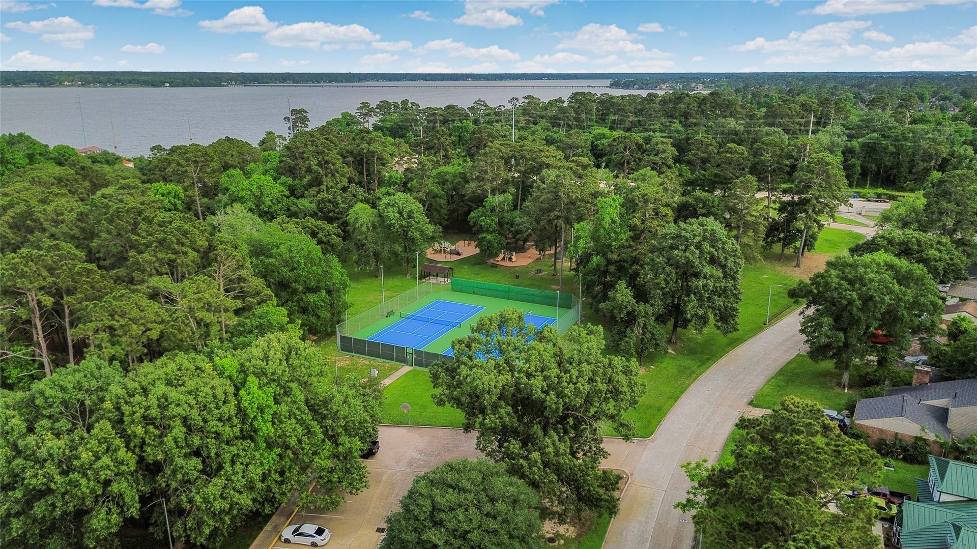 20214 Powerscourt Drive, Humble, TX 77346 The community offers fantastic lifestyle amenities, including professional-grade tennis courts and scenic walking trails near the lake