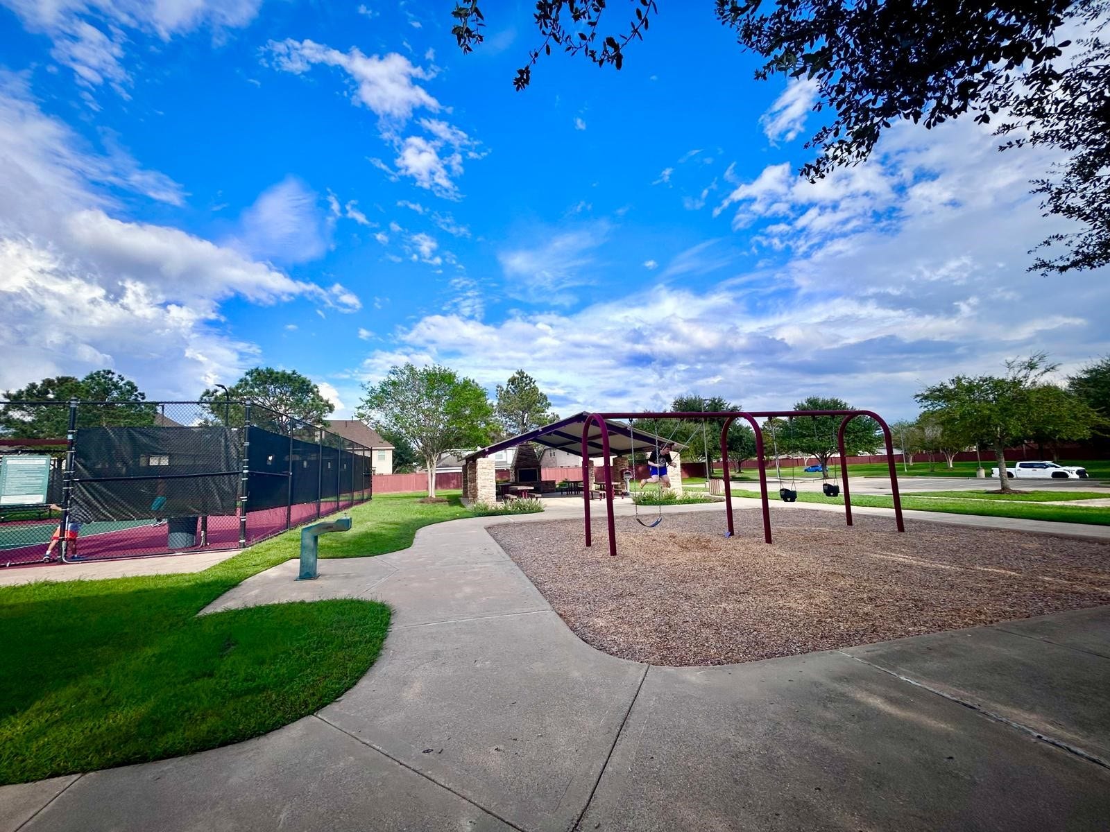 25918 Silver Timbers Lane, Katy, TX 77494 Community park with a playground, tennis court, and picnic tables.