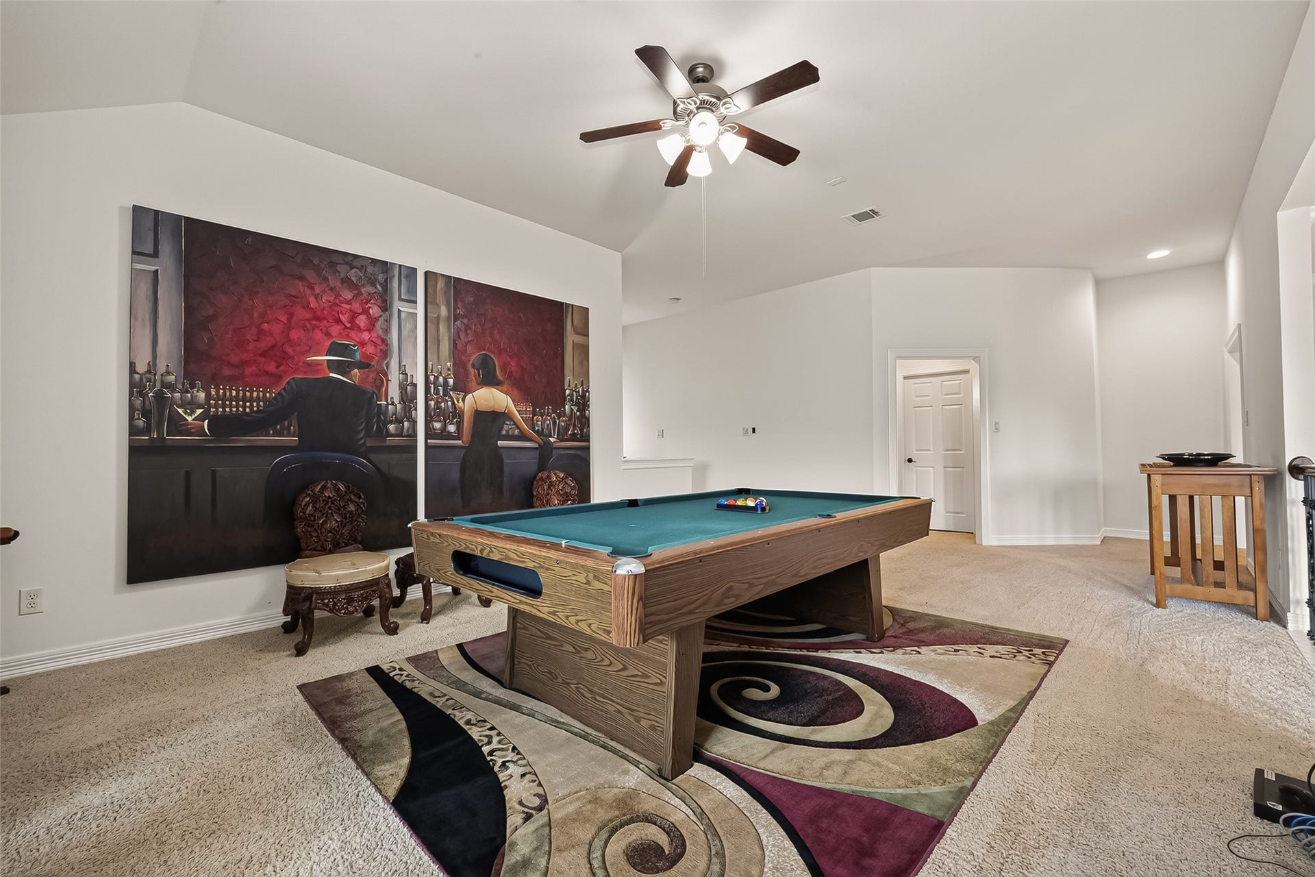 1814 Bartrum Street, Sugar Land, TX 77479 Game room with a stylish pool table, vibrant artwork, and plush carpeting, perfect for entertaining and relaxation.
